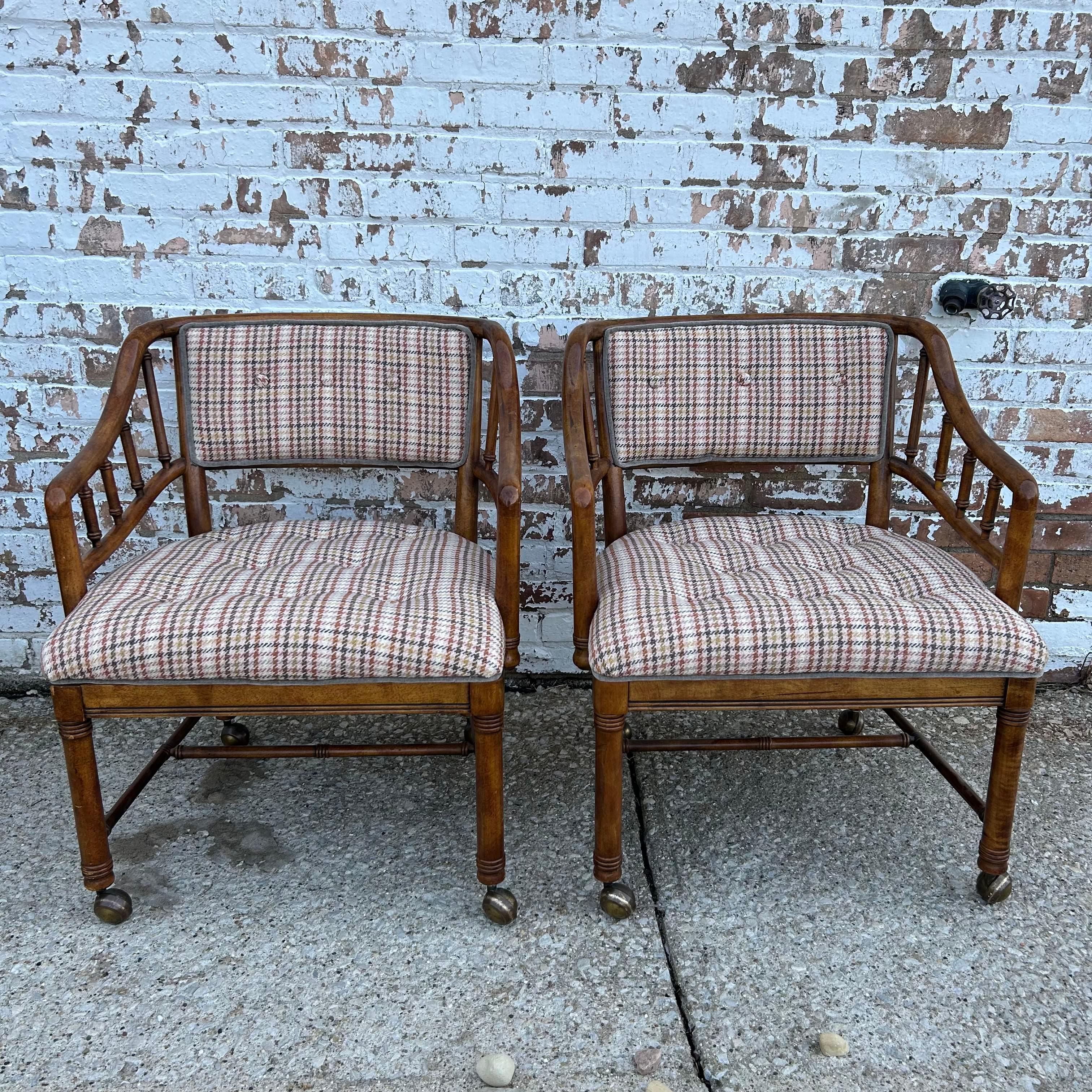 Adorably chic, this 1960s chair pair from Plunkett Furniture Co, have been wonderfully reimagined. Beautiful faux bamboo frames, with their honeyed warmth, bring out the best in the pink infused plaid. Low contrast piping and smoothly rolling brass