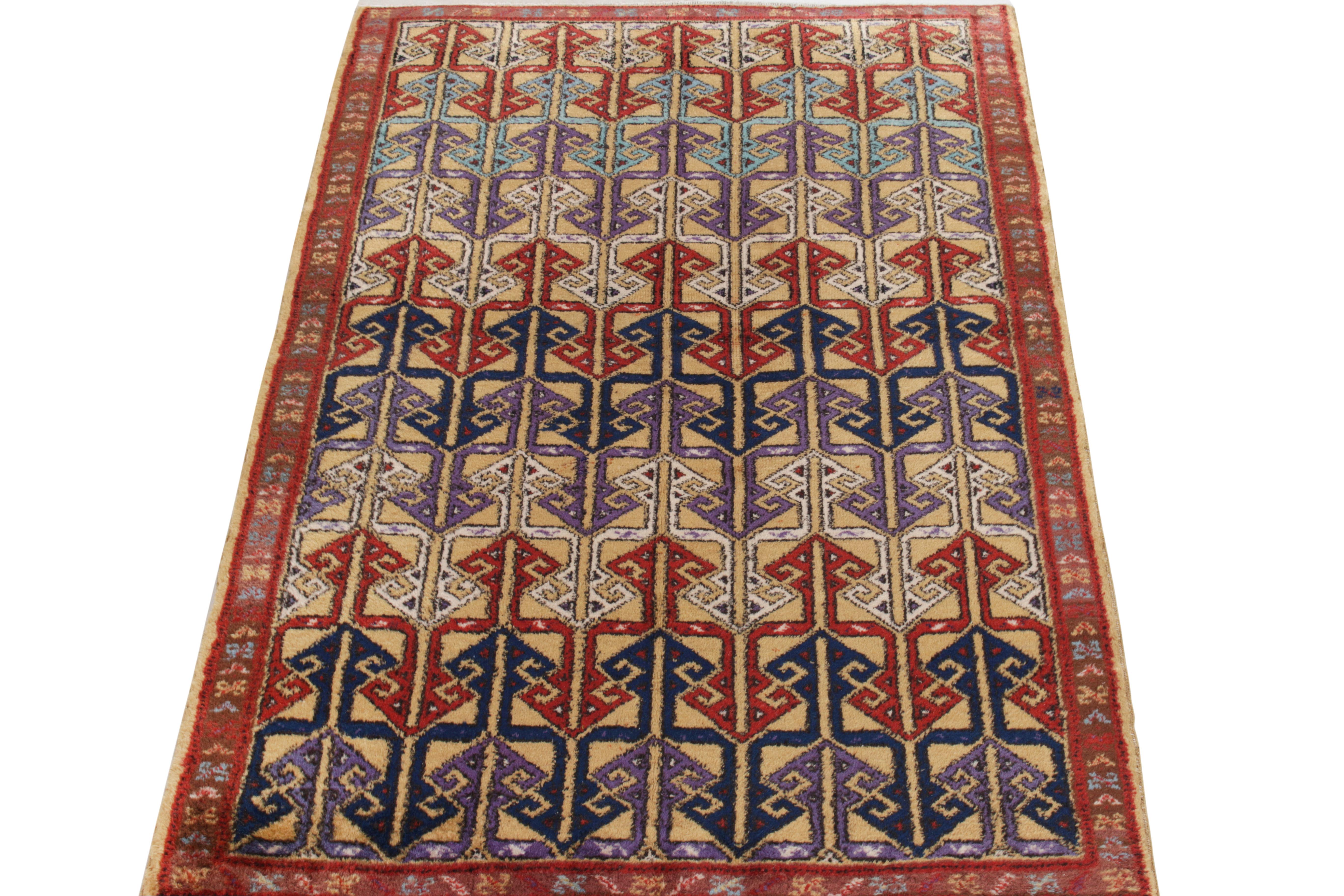 Hand-knotted in wool, a 4 x 6 vintage rug from a bold multidisciplinary Turkish designer commemorated in Rug & Kilim’s mid-century Pasha Collection. An uncommon geometric pattern in bold red, lilac, white & tones of blue sits comfortably on a beige