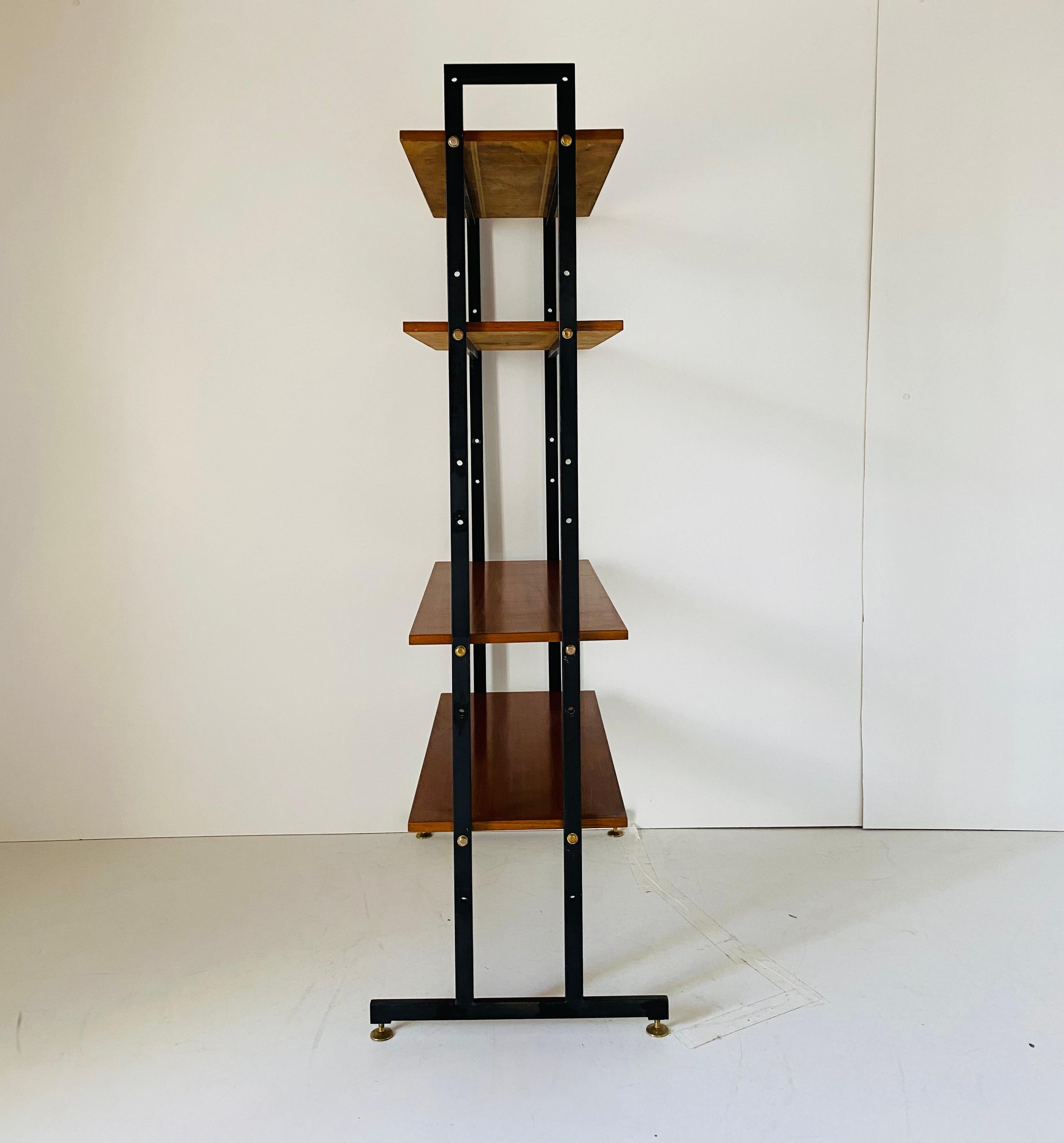 Vintage Scandinavian Shelf, teak, iron, Scandinavia 1960s.
Elegant vintage book shelf in scandinavian style. Teak wood shelves with a black iron frame and brass round feet. Wood has been polished and major damages have been repaired. In very good