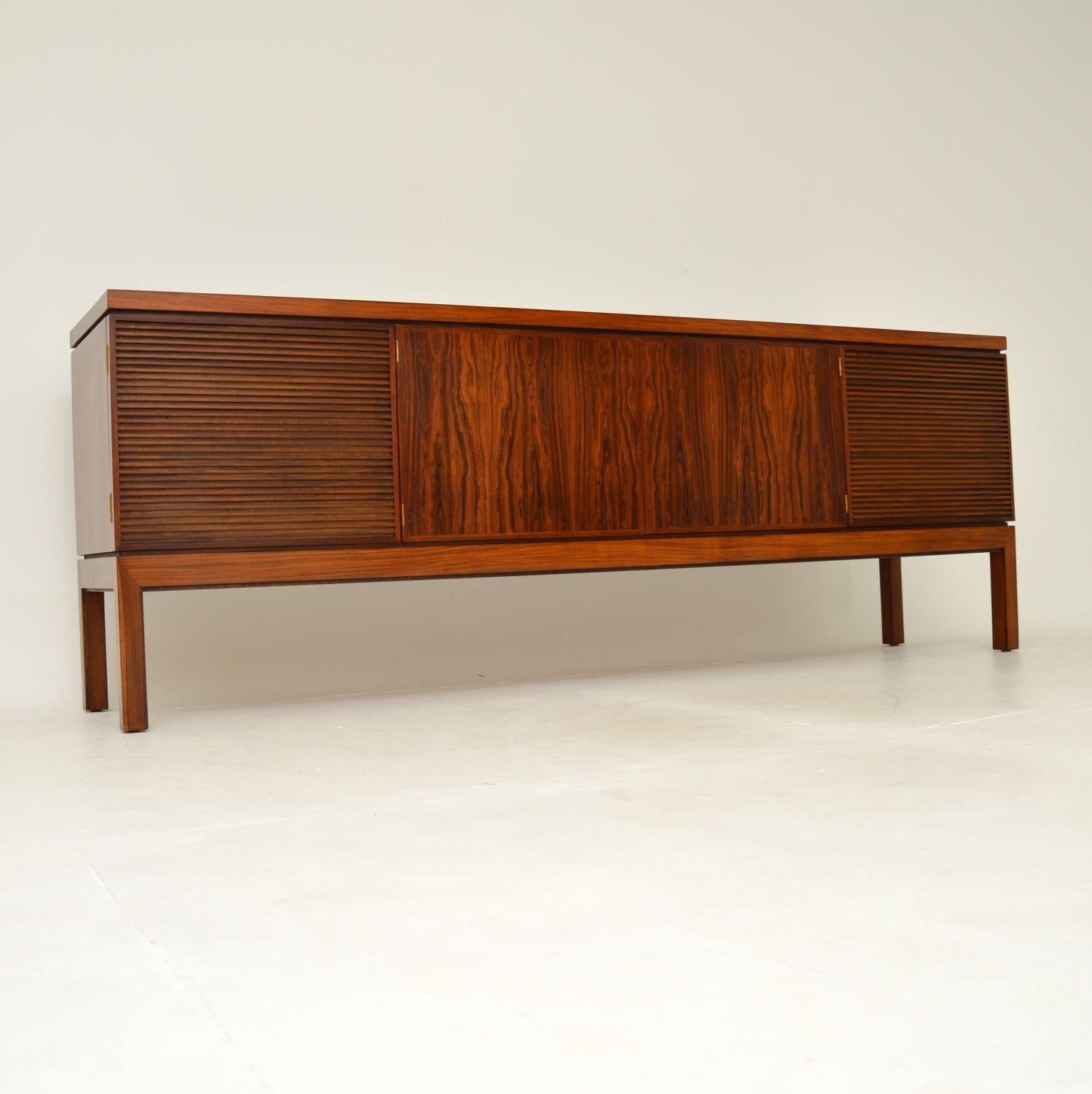 A stunning vintage sideboard, this model is called the ‘Bridgford’ sideboard. It was designed by Robert Heritage for Archie Shine, and was made in England in the 1960’s.

This is of amazing quality, with many fine features. There are stunning wood