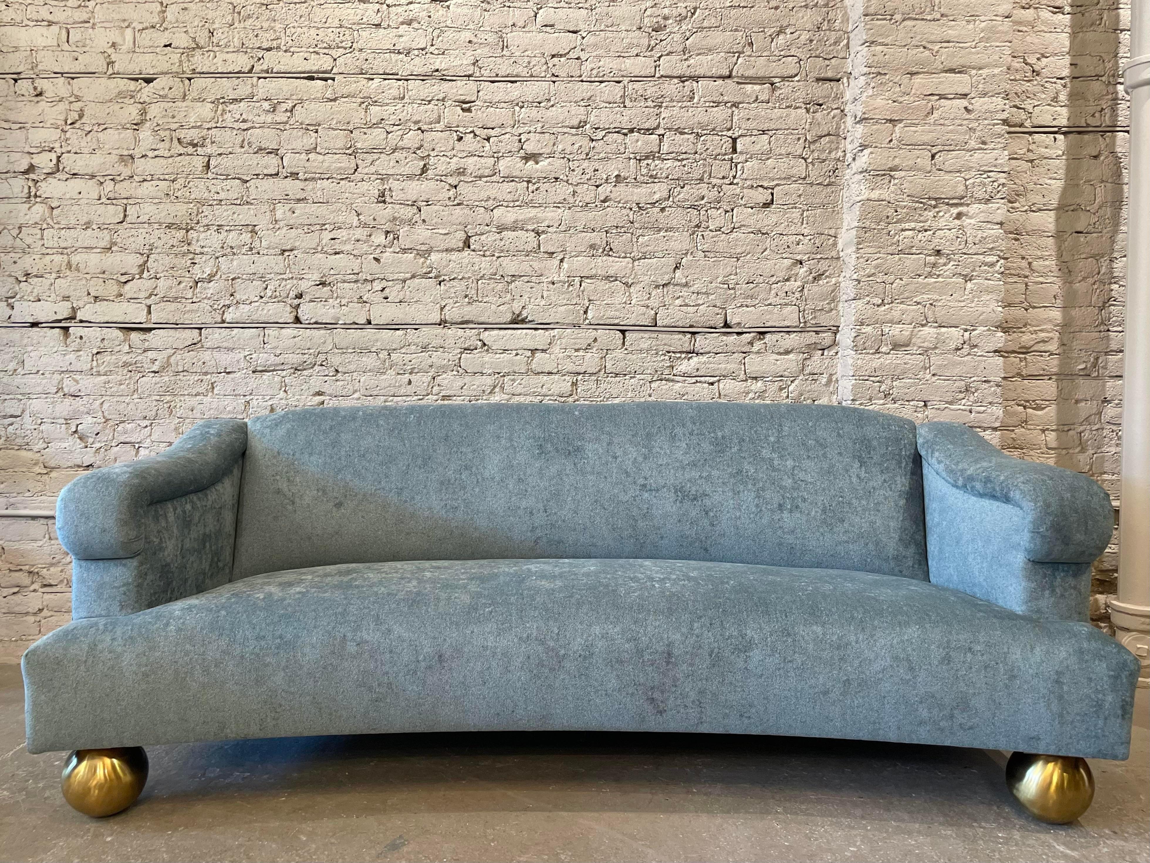 Breathtaking sofa from the 1960s. Reupholstered in a soft blue with custom brass feet. Absolutely stunning and ready to go.