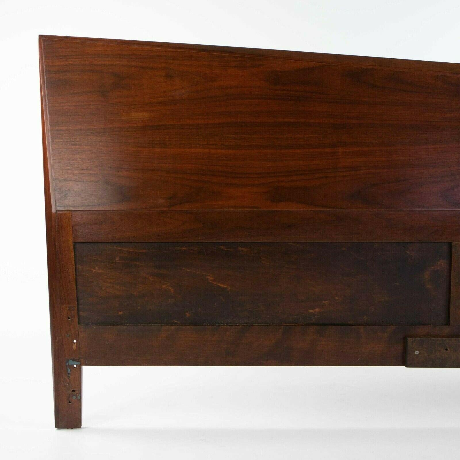 Listed for sale is a gorgeous solid black walnut headboard from a Manhattan estate. The headboard is beautifully constructed and king-size. Whereas most modern pieces of this era were constructed from veneers entirely, this appears to be mostly if