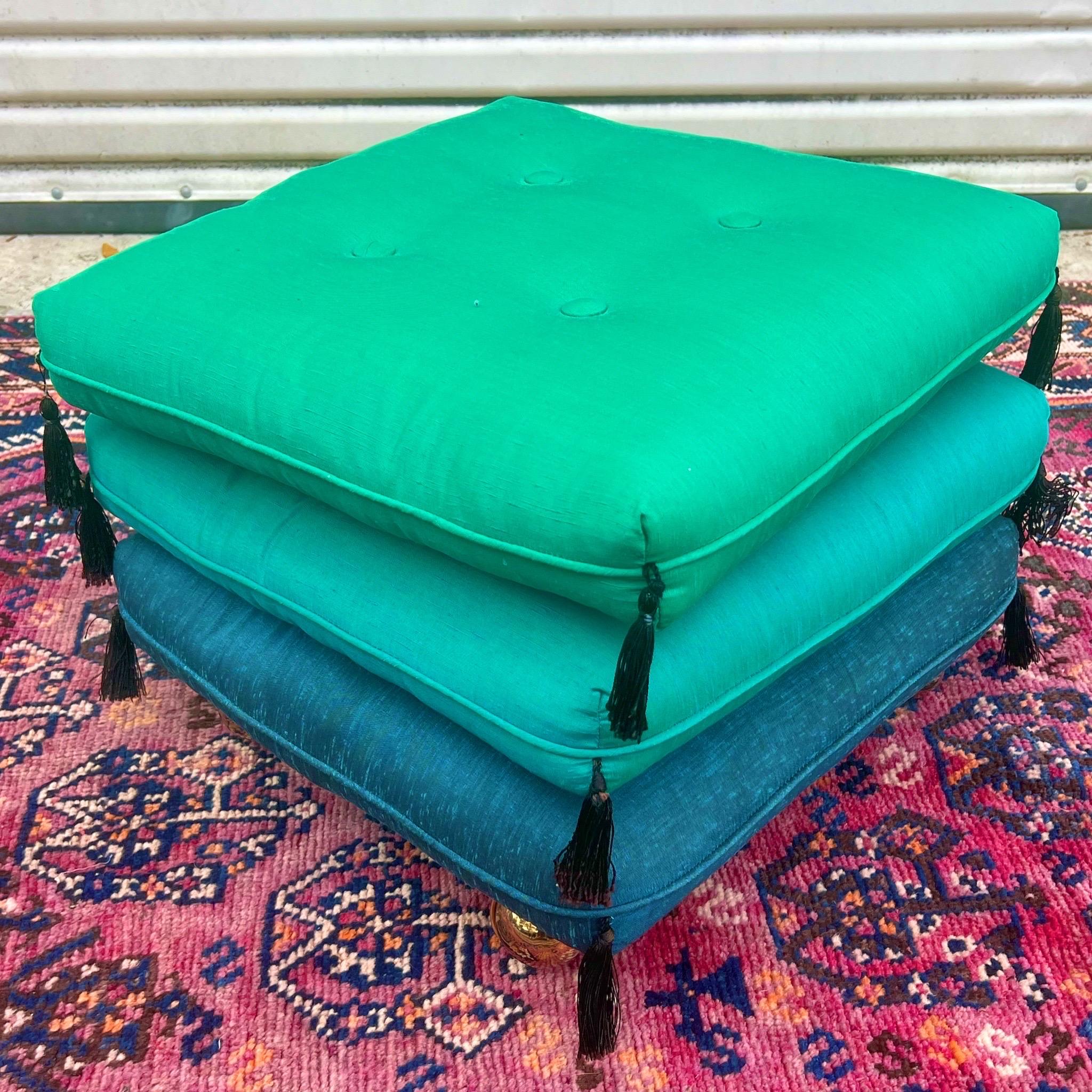 Blue, turquoise, and the most Stunning green stacking pillow ottoman. Perfect accent for extra seating and a statement. Durable vintage fabric . The bottom cushion is solid with a cushion top and on casters and the top two are flippable pillows.