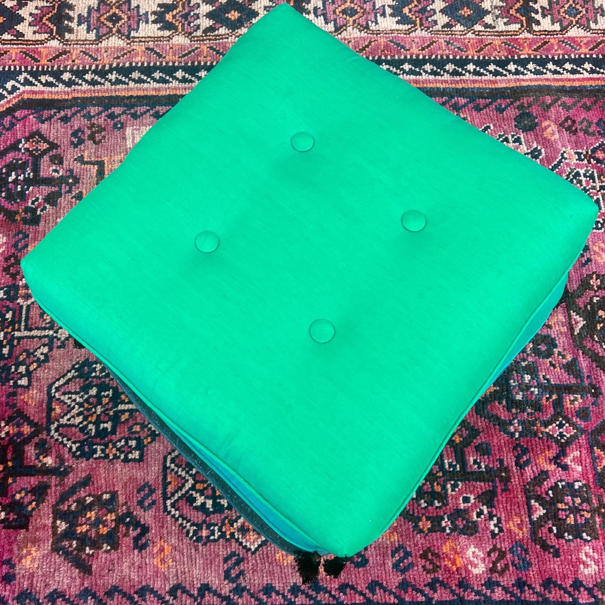 Hollywood Regency 1960s Vintage Stacked Blue/Turquoise/ Green Pillow Rolling Ottoman For Sale
