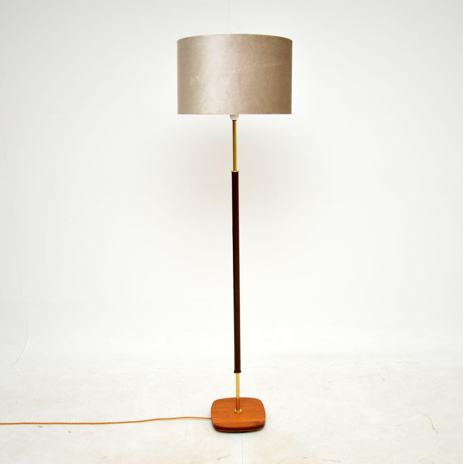 A superb vintage floor lamp in brass, teak and leather. This was recently imported from Sweden, it dates from the 1960s-1970s.

The quality is amazing, this is beautifully made, with most of the lower potion covered in a gorgeous dark brown leather.