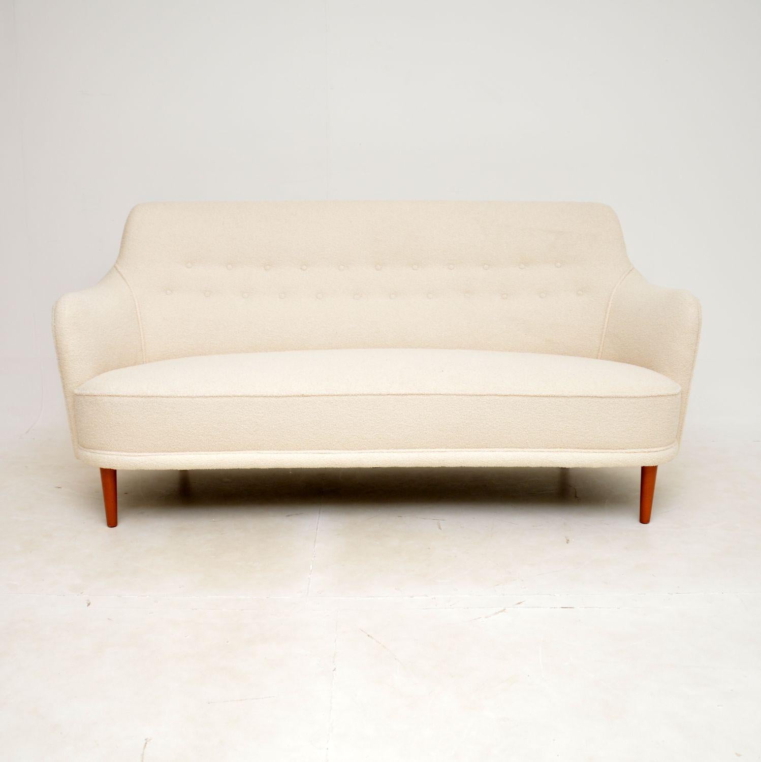 A stunning and extremely comfortable vintage Swedish sofa. This design is called the ‘Samsas’ sofa, it was designed by Carl Malmsten and dates from the 1960s.

This is of extremely high quality, the well built frame looks amazing from all angles
