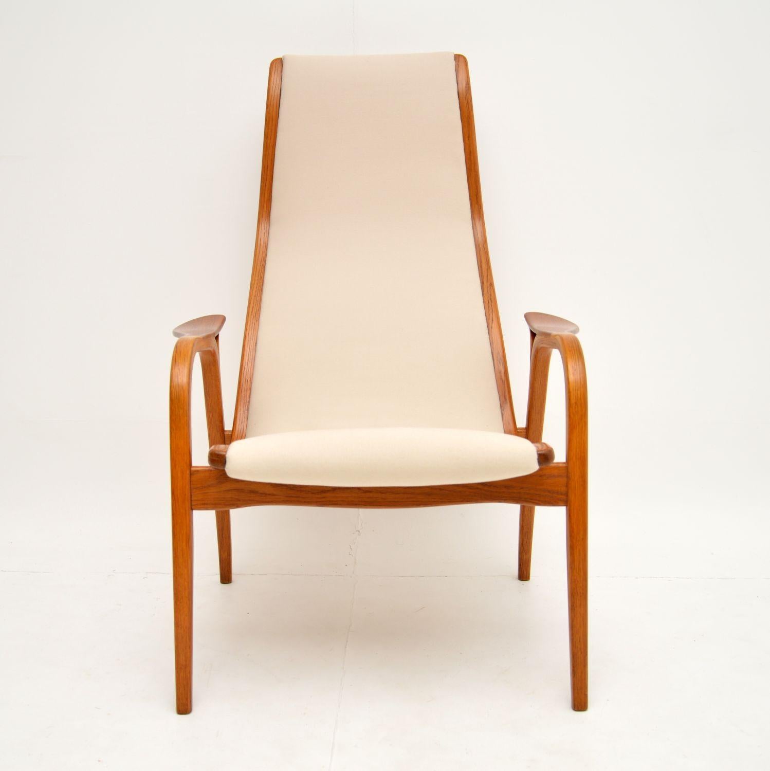 A stunning and iconic armchair, this is the Lamino chair. It was designed by Yngve Ekstrom and made by Swedese in Sweden, it dates from the 1960s-1970s.

We have had this fully restored and it is in superb condition throughout. The teak frame has