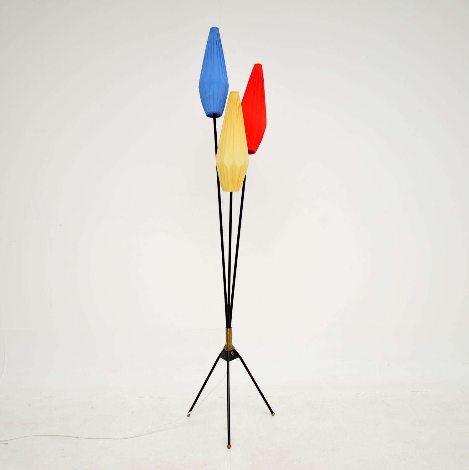 A very stylish and extremely well made vintage floor lamp. This was made in Sweden, it dates from around the 1960-70’s.

It is of amazing quality with a beautiful design. The tripod stand is made from ebonised steel, with brass feet and a coiled