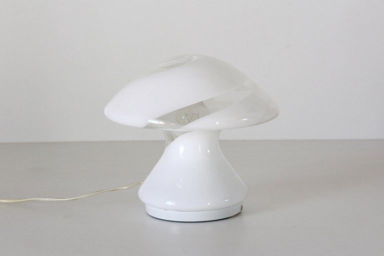 A beautiful Murano table lamp mushroom shape Murano glass designed by Carlo Nason for Mazzega in the 1960
In very good conditions with only some sign of time on the base. Electrical parts have been revised by a professional electrician. Perfectly
