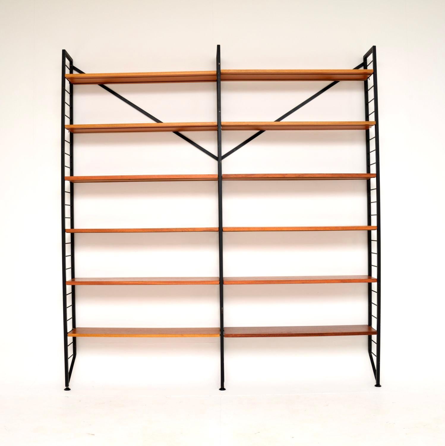 A very stylish and practical vintage shelving unit in teak by ladderax. This was made in England, it dates from the 1960’s.

This is a clever and iconic design, the ladderax units were made by Staples and were designed to be extremely flexible, self