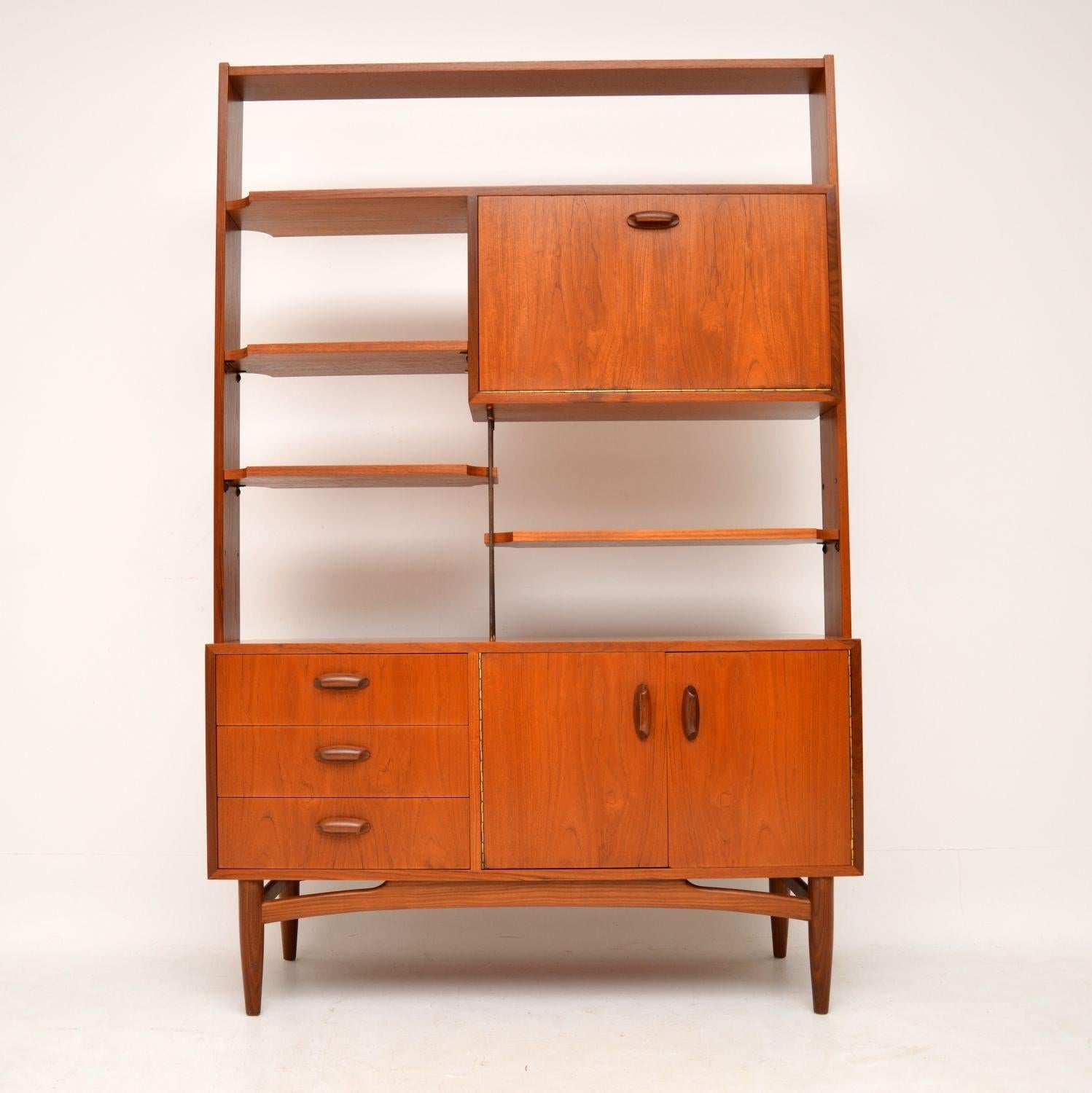 A stylish, top quality and very useful storage unit by G-Plan, dating from the 1960s. This is perfect for use as a wall unit or a room divider, as the back is beautifully finished as well. The shelves are adjustable, and this has lots of storage