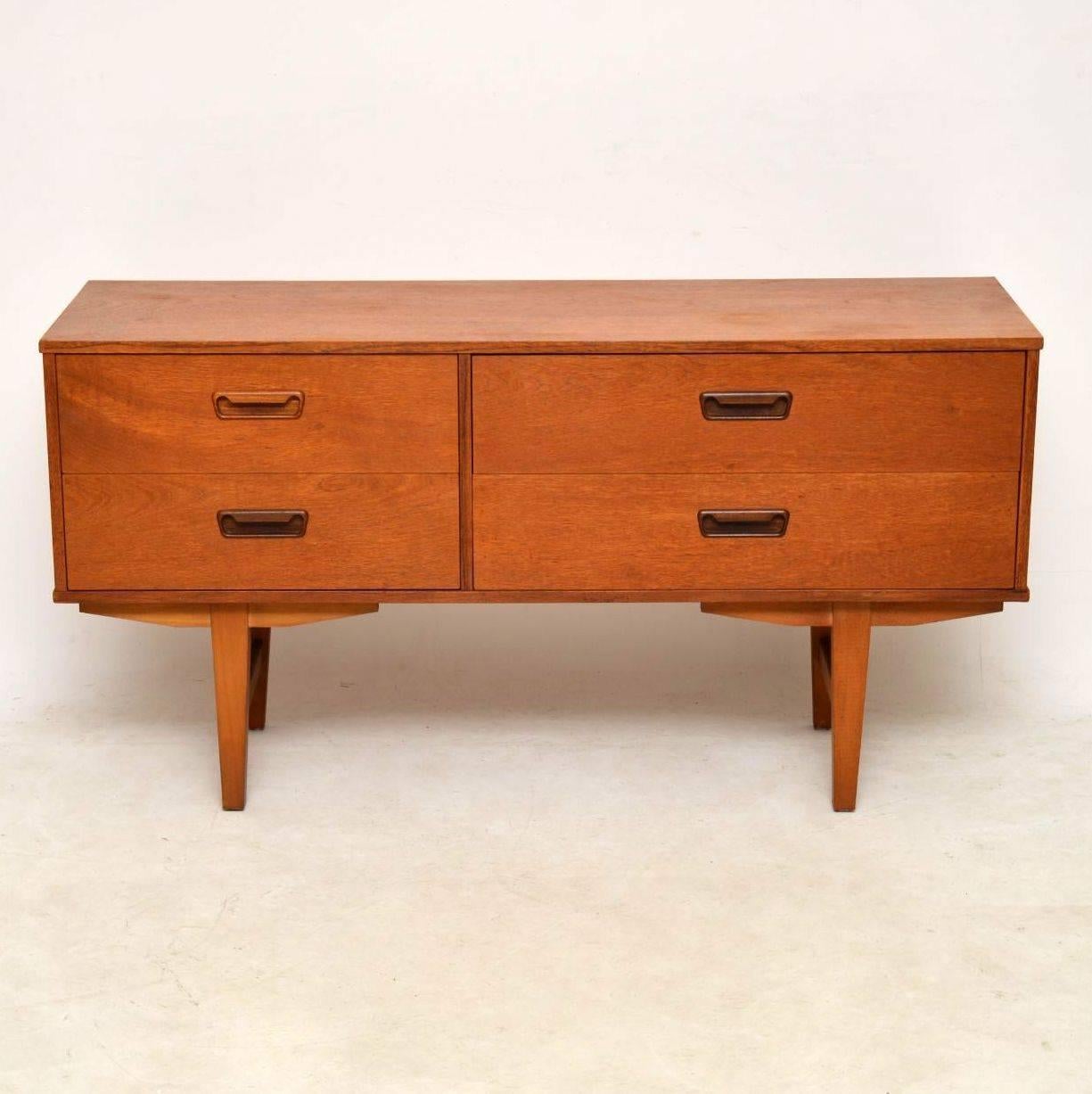 A stylish and petite vintage sideboard in teak, this dates from the 1960s. It’s very well made and is in excellent condition for its age, with only some extremely minor wear here and there.

Measure: Width – 129 cm
Depth – 40 cm
Height – 66 cm.
