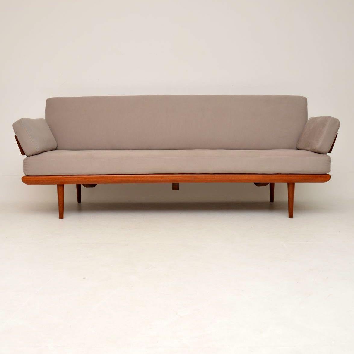 A stunning and extremely comfortable sofa designed by Peter Hvidt and Orla Molgaard Nielsen, this is an early model dating from the 1950s. It was made by France & Daverkosen, it retains the original badge under the seat cushion. We have had the