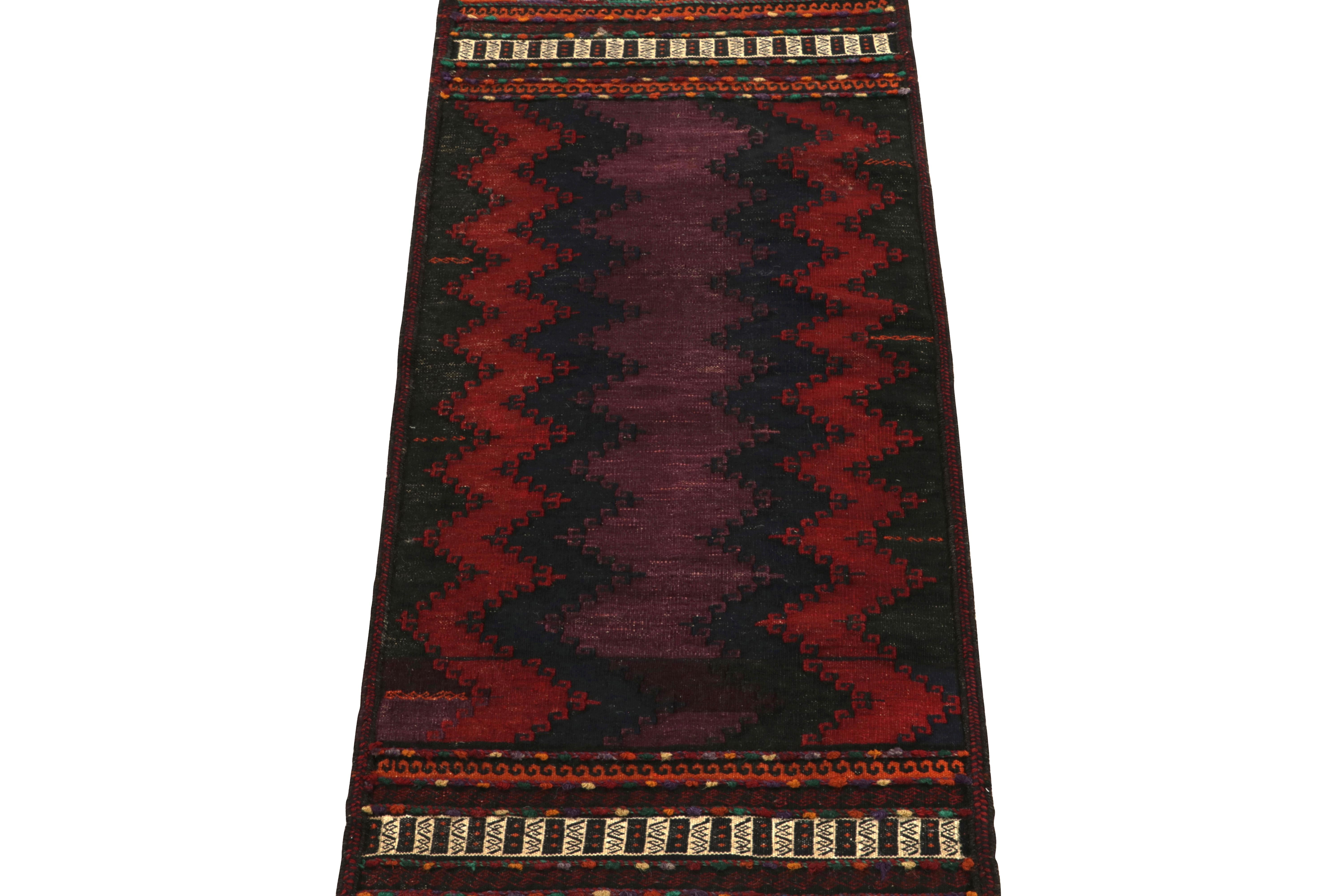 Handwoven in wool circa 1940-1950, a rare vintage kilim rug originating from Turkey carrying rich mid-century aesthetics. 

Second to none in collectible tribal inspiration, this 2x5 flatweave witnesses a marriage of hook and horn motifs &