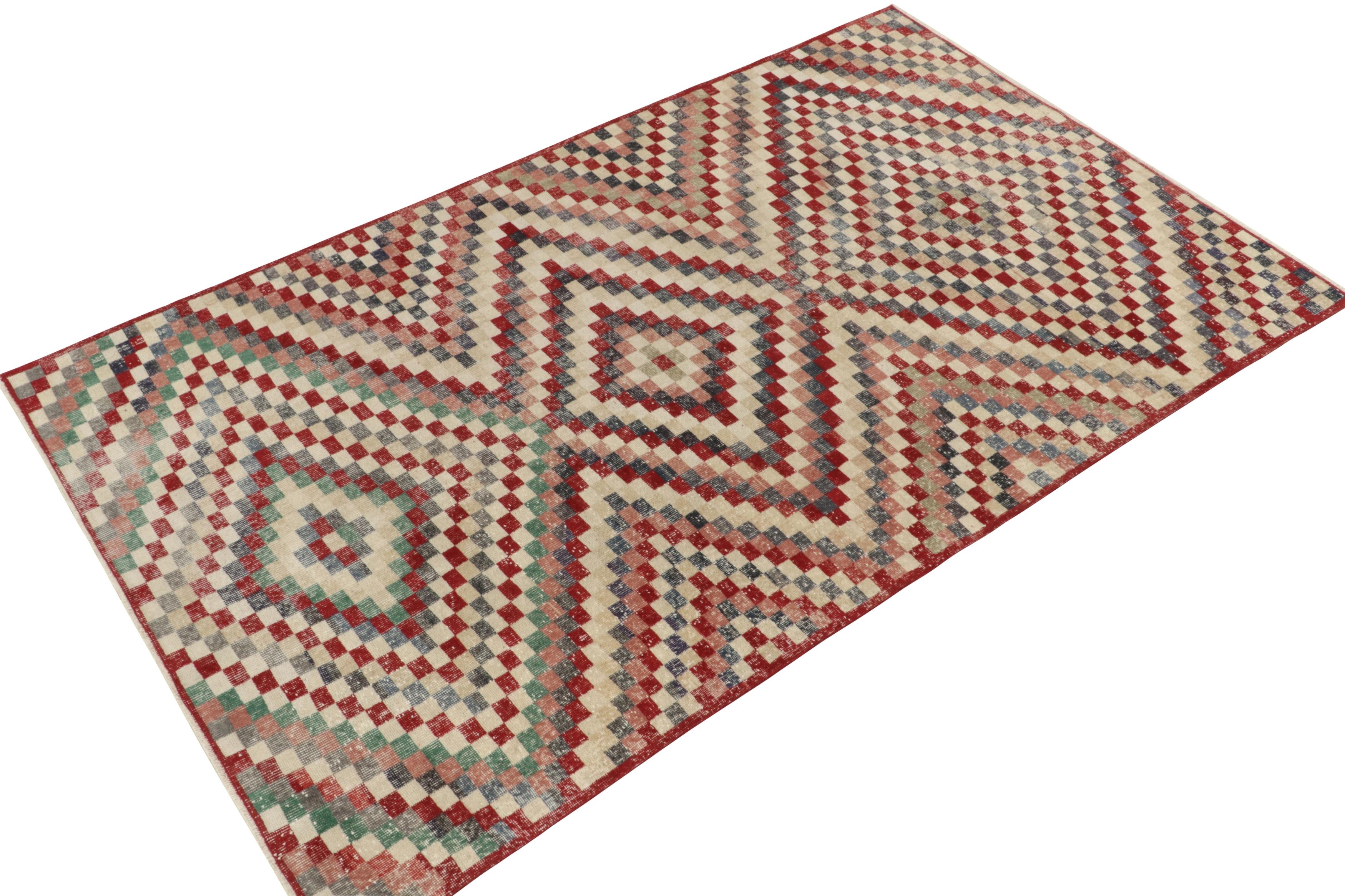 Hand-knotted in wool, a 6x10 vintage rug from a revered Turkish designer, entering Rug & Kilim’s commemorative Mid-Century Pasha Collection. 

This traditional spin enjoys a dextrous geometric pattern in variegated tones of red, blue, beige &
