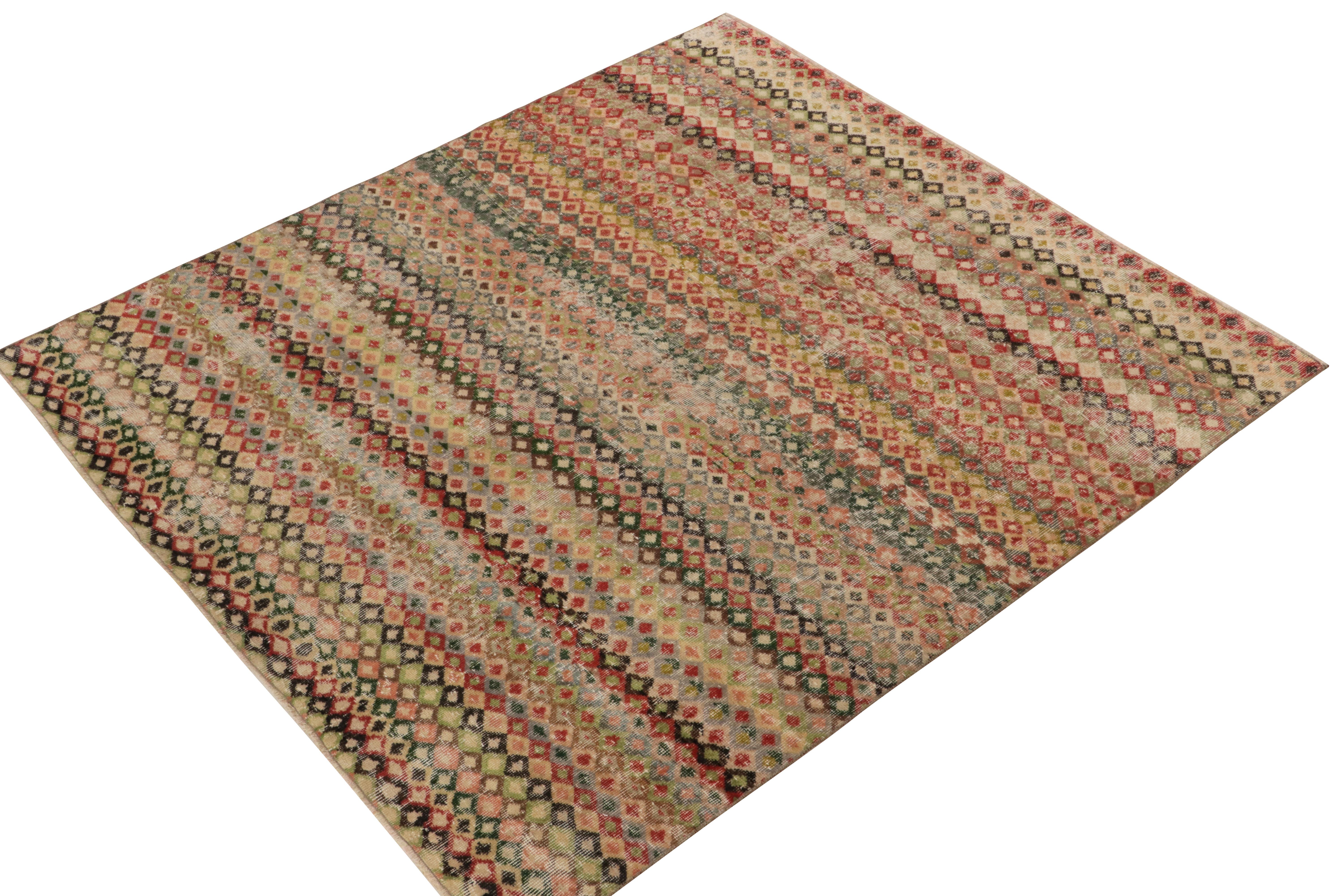 Hand-knotted in wool, a 6x7 vintage rug from a playful Turkish atlier entering Rug & Kilim’s commemorative Mid-Century Pasha Collection. 

This inviting piece enjoys a series of diamond patterns in variegated tones of red, pink, beige-brown &