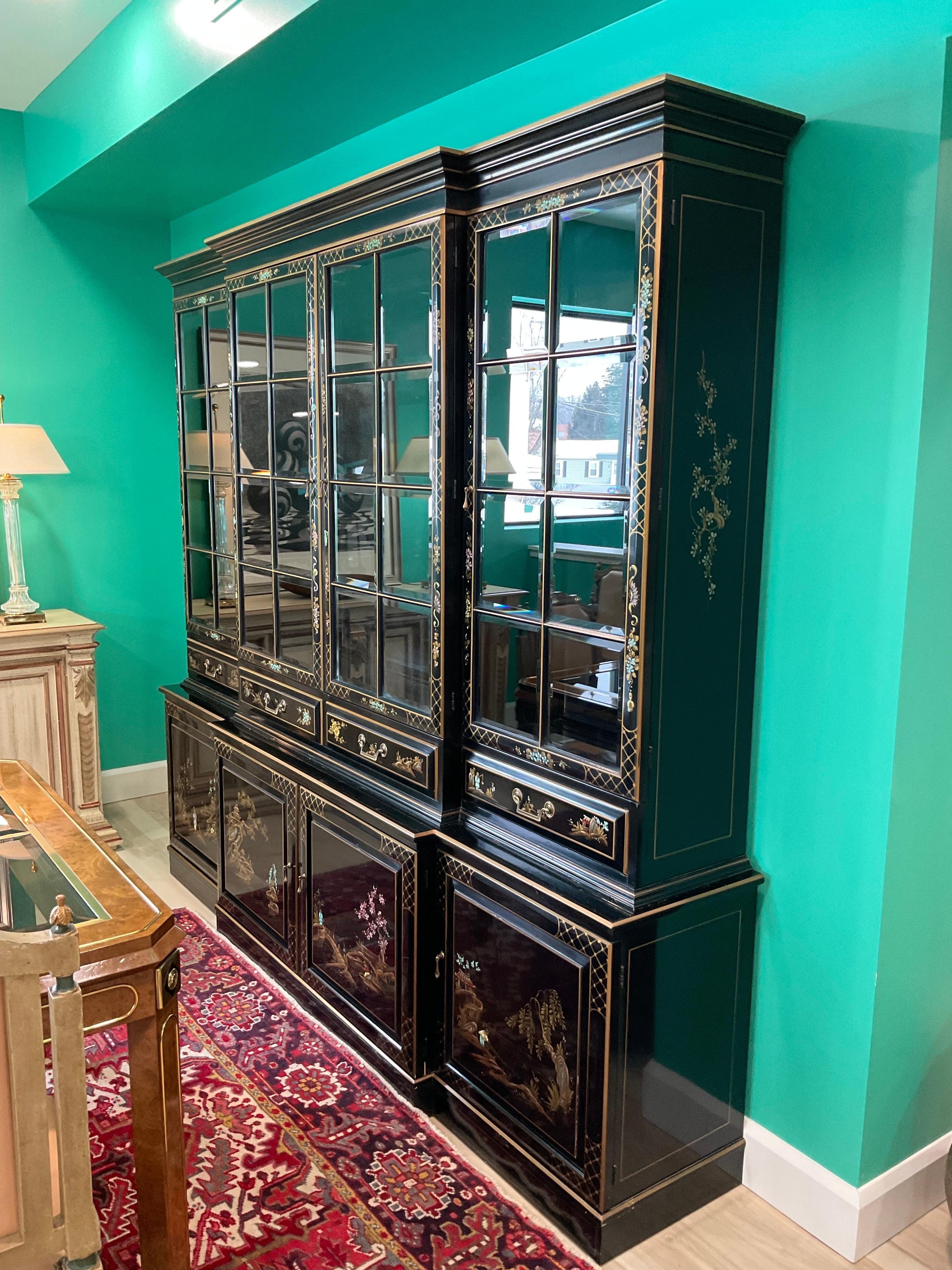 Monumental Union National black lacquer Chinoiserie China Cabinet circa 1960’s. Beautiful piece. Typical checking in the vintage lacquer. Beautiful vibrant colors in the hand painted details. Fewer than 20 of these spectacular cases were made per