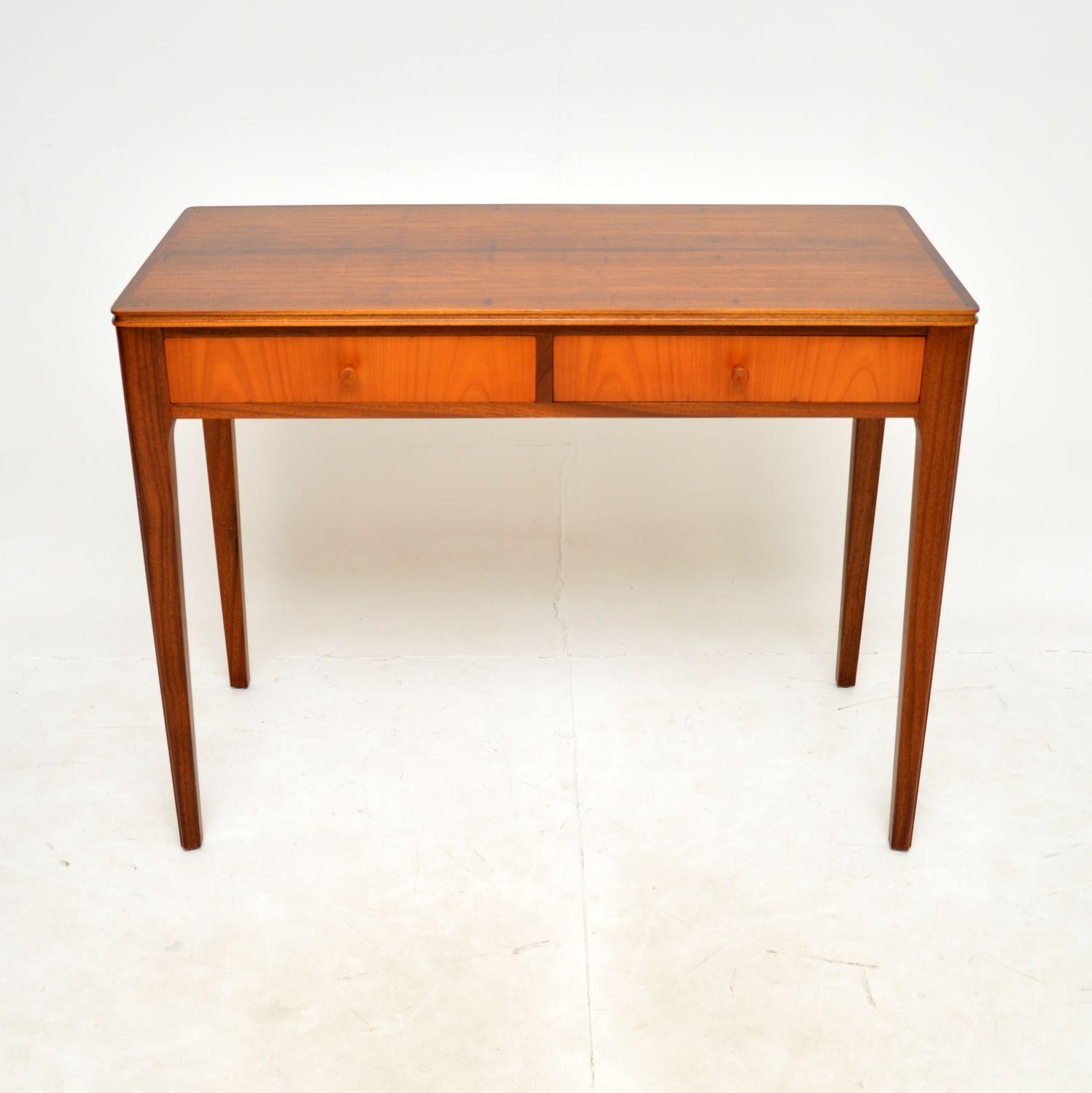 A very stylish and well made vintage console table / desk. This was designed and made by Storys of Kensington, it dates from the 1960’s.

It is a very useful size and is of super quality. It would make a perfect entry way table and is equally