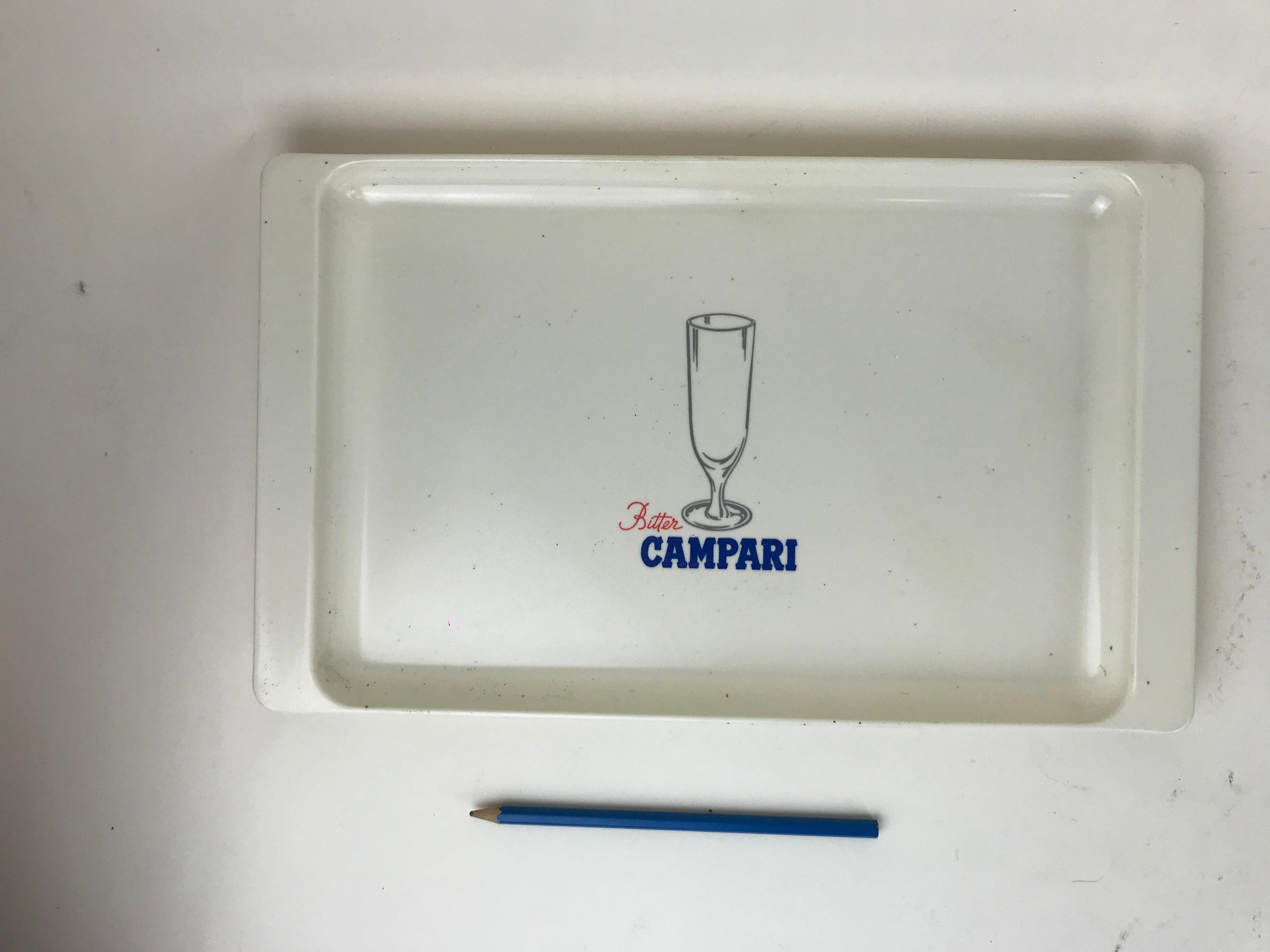 Vintage white plastic rectangular bar tray made in Italy by KEAN Milano for Campari. 

Mark on bottom:
Viale Maino 25
KEAN
Milano
Made in Italy

Collector's note:

Campari is an Italian alcoholic liqueur, considered an apéritif obtained