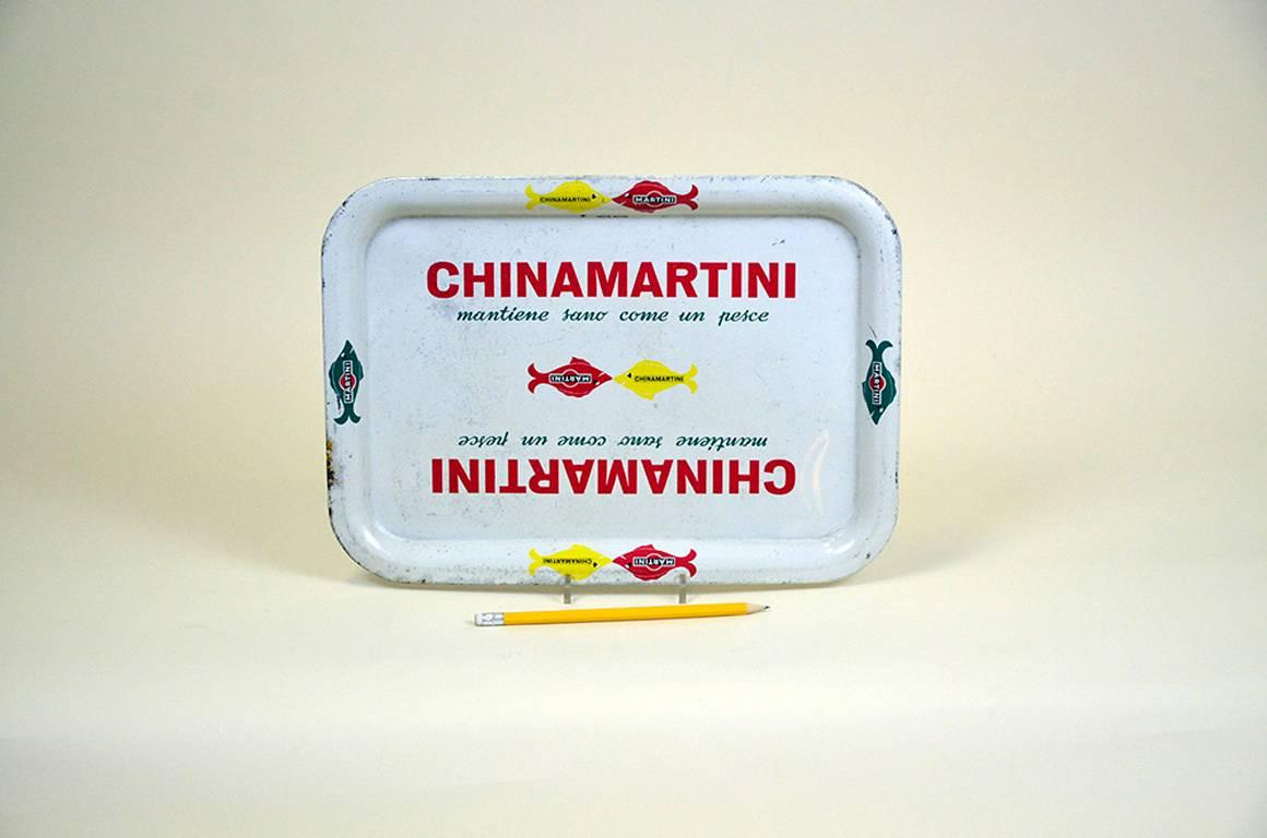 Italian vintage rounded China Martini metal tray produced by Pelliconi, Bologna in the 1960s.

The tray is decorated with the slogan 