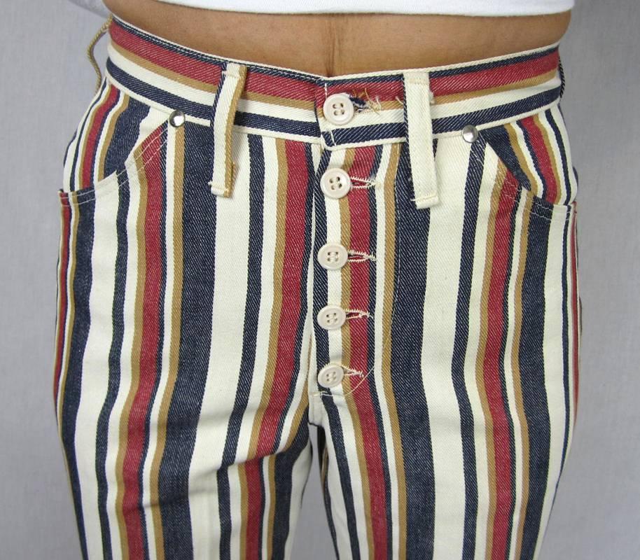 They have been in a store for the last 40+ years. Vintage 1960s Striped Wrangler jeans. New Never worn.  measuring 27 inch waist. Up to 35 hips. 30 inch inseam. 41' Long. 9.5in wide bell bottom. Tags are still attached to them. Made in USA. Fit like
