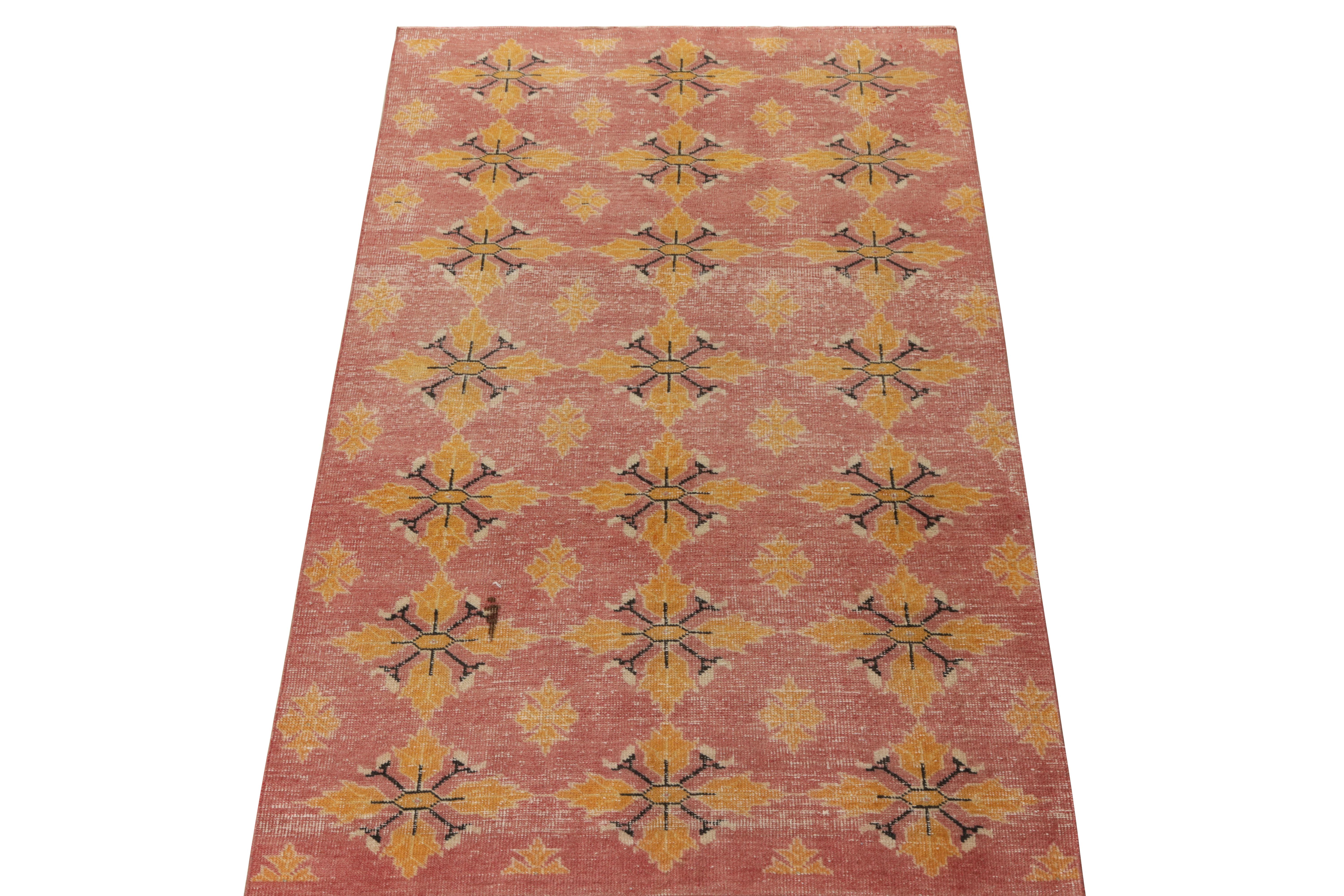 Hand-knotted in wool, a 4x8 distressed style vintage rug from the celebrated artist Zeki Muren—the latest to join Rug & Kilim’s commemorative Mid-Century Pasha collection. The piece finds its value in a refined diamond floral pattern in pink and