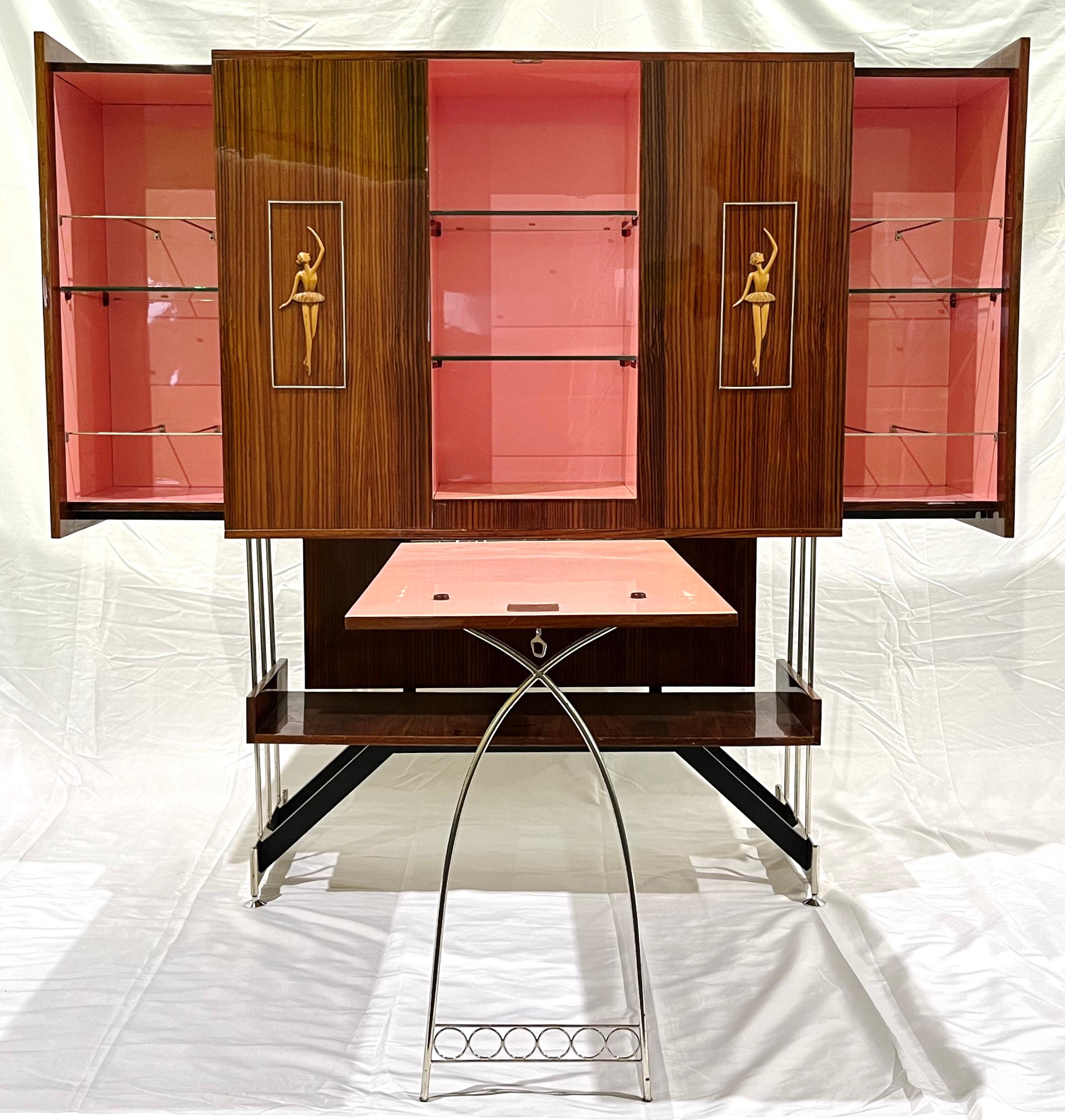 Mid-20th century rare vintage find attributed to Vittorio Dassi: Italian Rosewood Dry Bar / Buffet Cabinet with drop-down table and pull-out sides to reveal inner shelving with bottle and glasses racks, entirely hand-crafted. This unique Italian