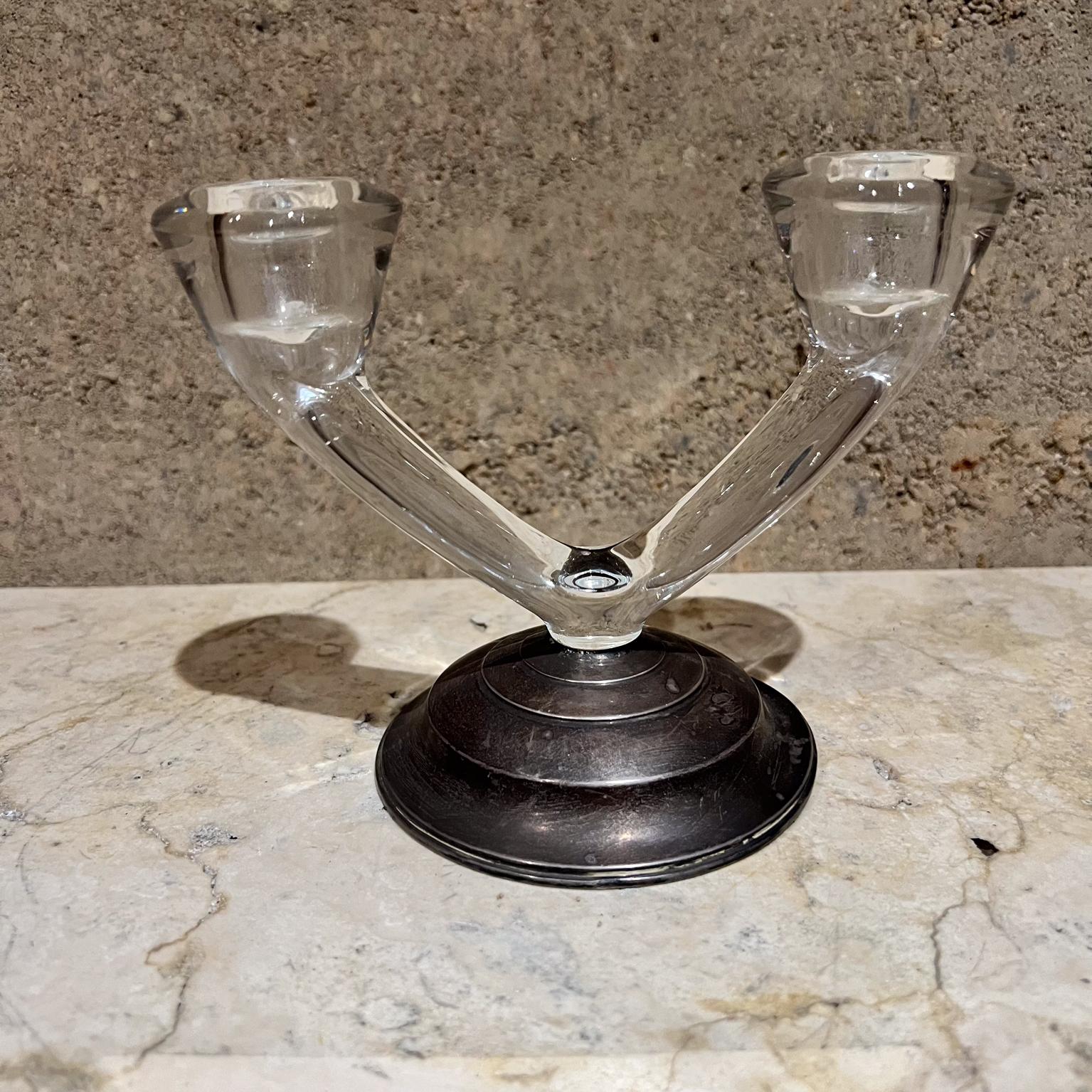 1960s Two Arm Sterling Silver and Glass Candle Holder Candelabra by W M Rogers. USA
base sterling silver top section glass.
5 h x 6.25 w x 3.88 diameter
Original vintage unrestored condition. Vintage patina present. 
Glass is in good shape. The base