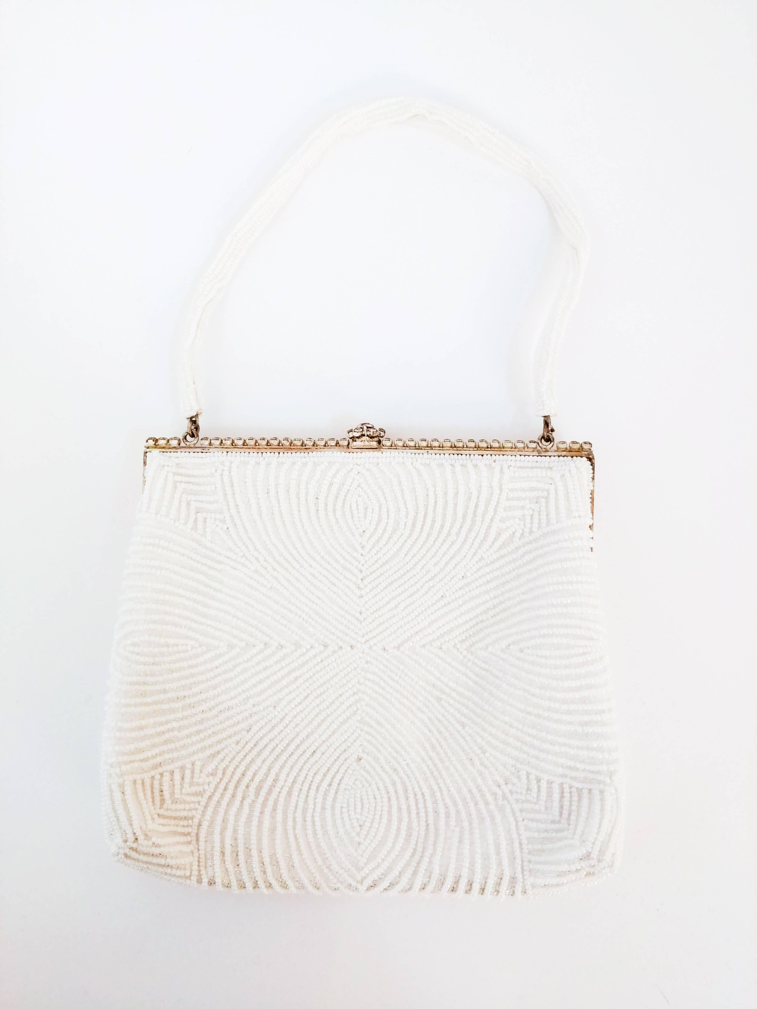 1960s Walborg White Beaded Evening Purse w/ Rhinestones. White silk satin lining, comes with matching mirror. Geometric design on front done in rhinestones on all-over beaded purse, and rhinestones on gold toned hardware and clasp.
