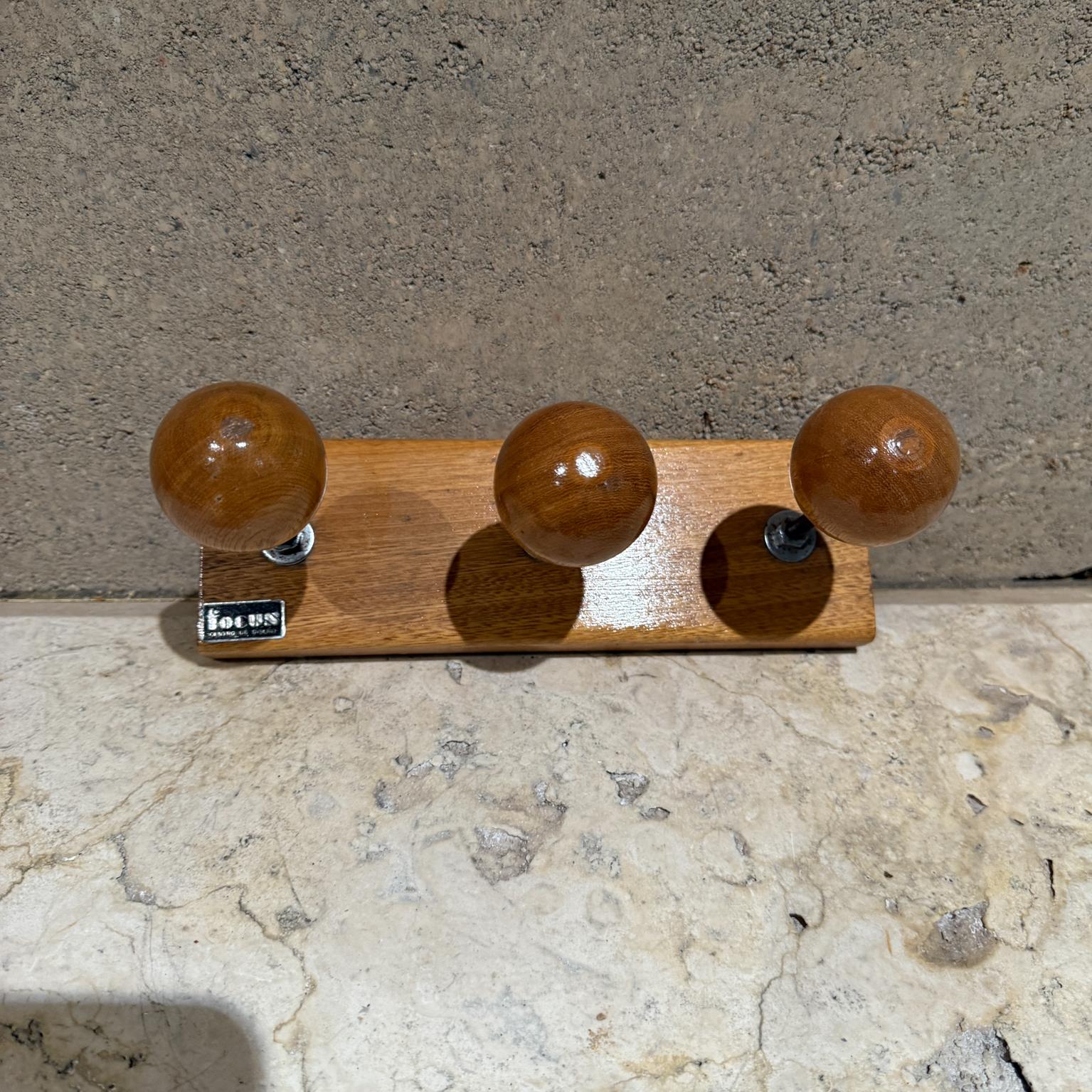 Scandinavian styled Coat Rack Wood and Iron.
Wood appears as maple with glossy varnish.
3.25 x 9.75 x 5.25
Label from the maker in lower left corner.
Premade holes make it easy to install into wall. No hardware is included.
Original vintage
Refer to