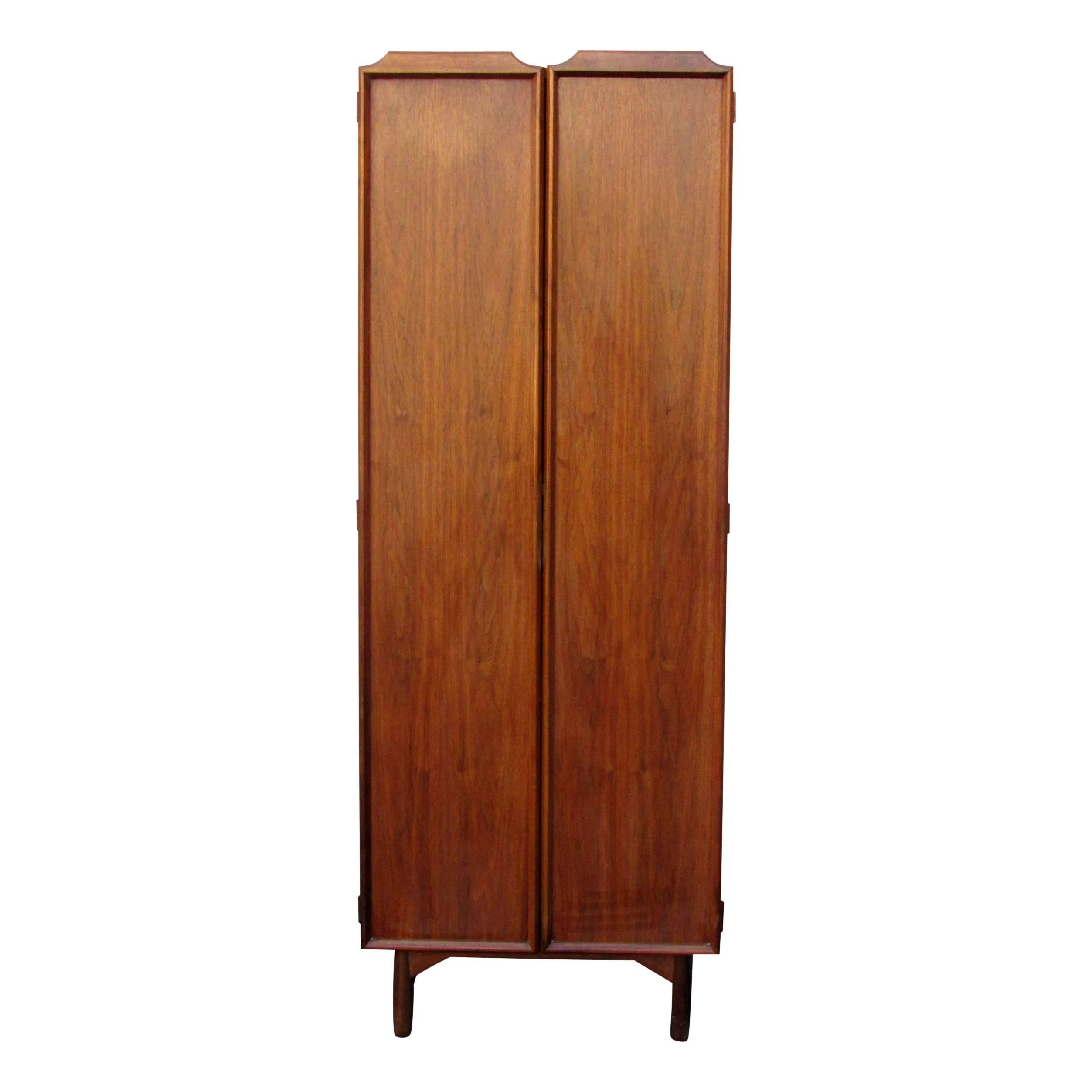John Keal Dressing cabinet for Brown Saltman of California,  1960s.   Chest has six drawers,  tie/accessories swing out arms, carved out impressions for accessories or change,  a vanity mirror and an interior light.  