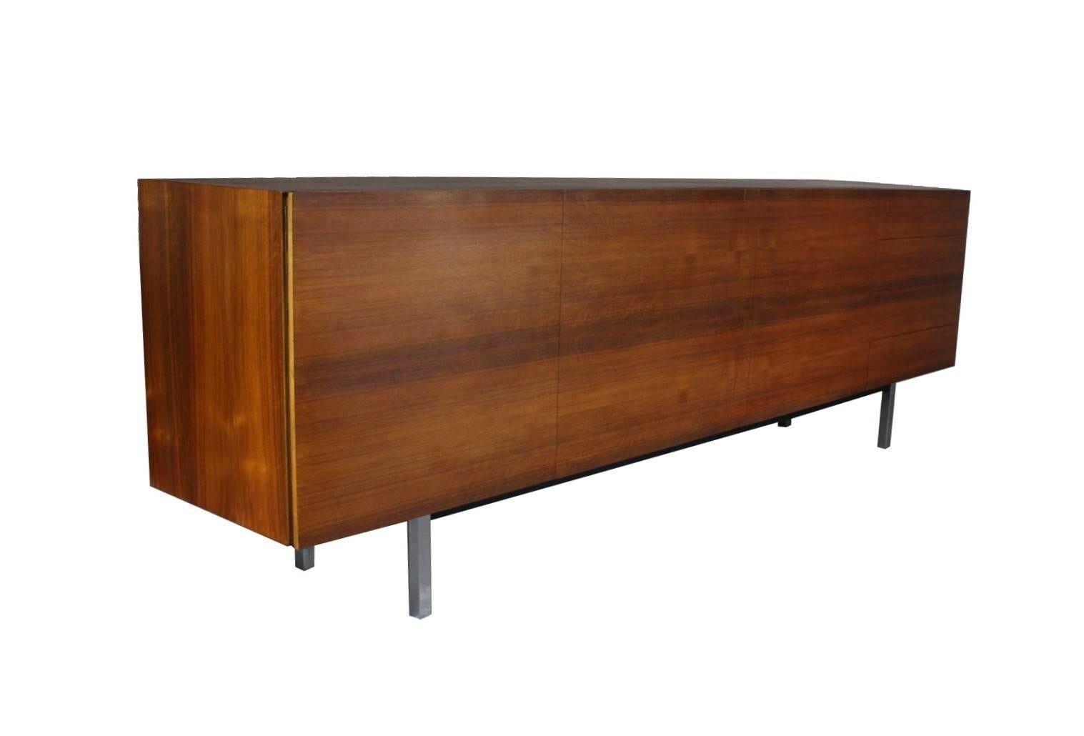 Long sideboard from the 1960s, made in Switzerland. Walnut veneer, steel base. The sideboard is in good original condition.
