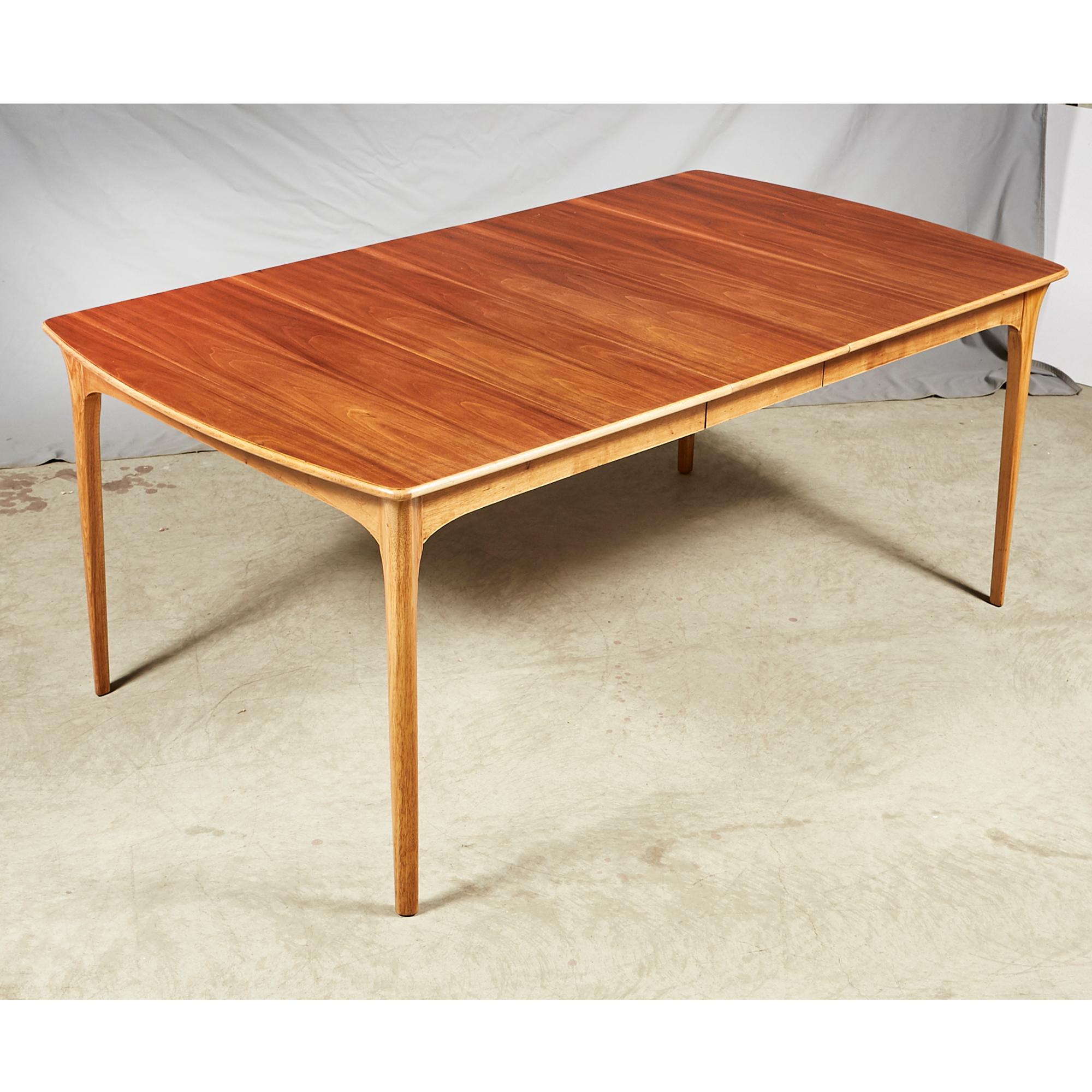 Vintage 1960s walnut top and ash wood base dining room table. The table has one extra board that is 12in. L. Table fully open is 72in.L. Newly restored and in excellent condition. No maker's mark.
      