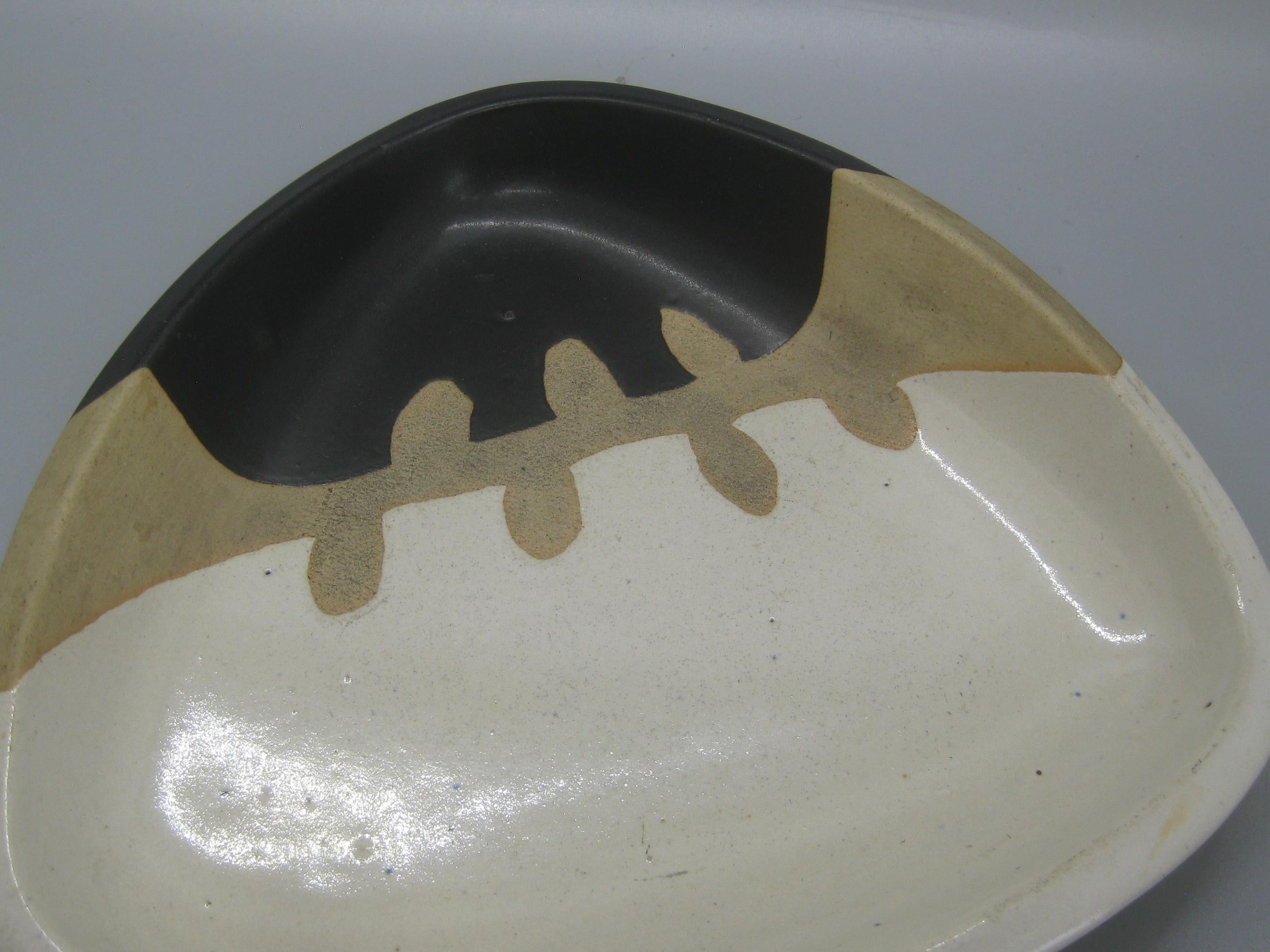 Great freeform modernist Studio Pottery low bowl by Walter Dexter, circa 1960s. Seldom seen Studio Pottery by this Canadian artist. Signed on the bottom as seen in the photos. Great form and design. Measures approximate: 7 1/2
