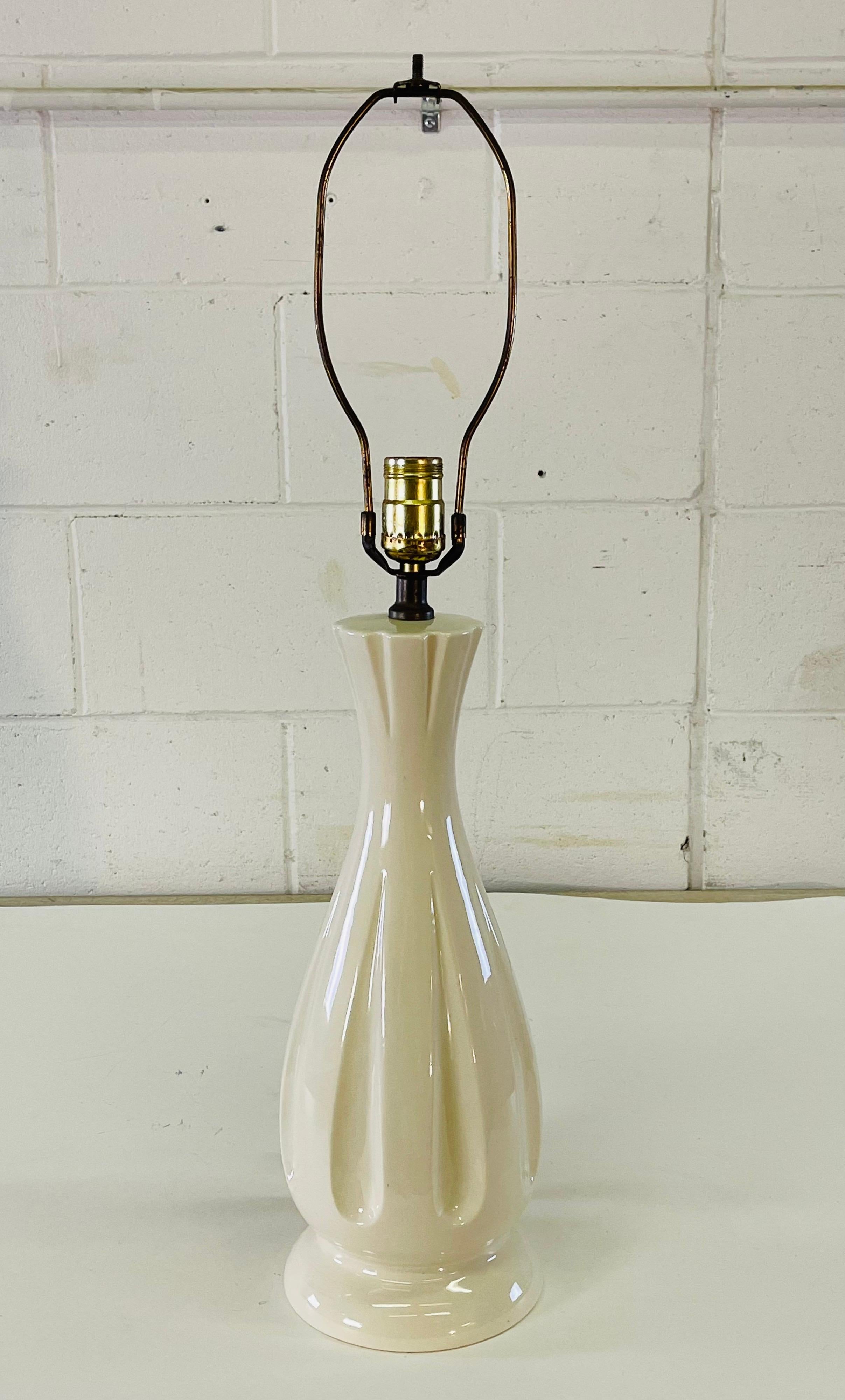 Vintage 1960s white ceramic table lamp. Wired for the US and in working condition. Socket, 19.5”H. Harp, 4”Dia x 10”H. No marks.