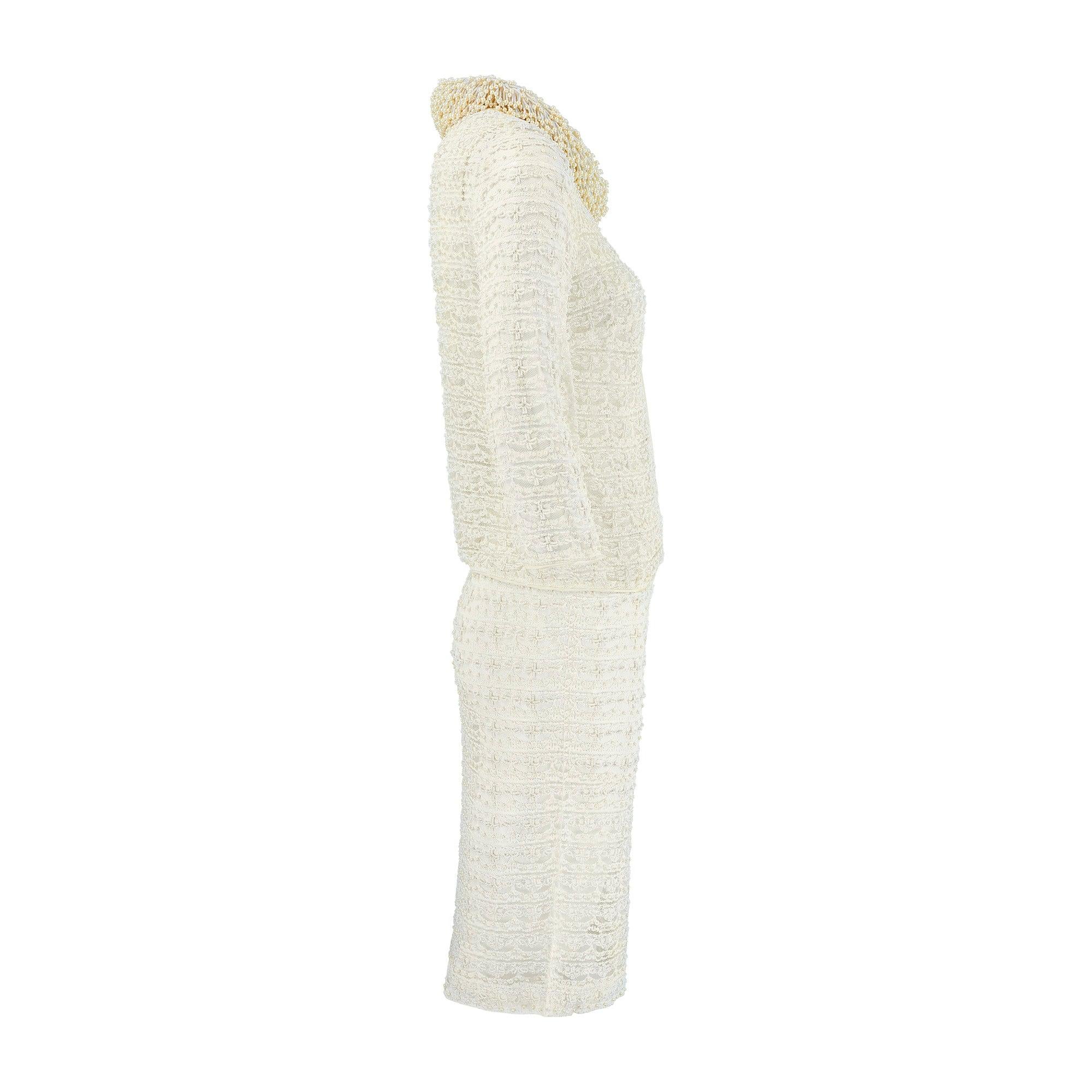 This stunning two-piece ensemble is unlike anything we’ve ever seen before. We believe it to have been made in Hong Kong in the 1960s, an area known for its outstanding beadwork during this time. The look is composed of a dress with a simple,