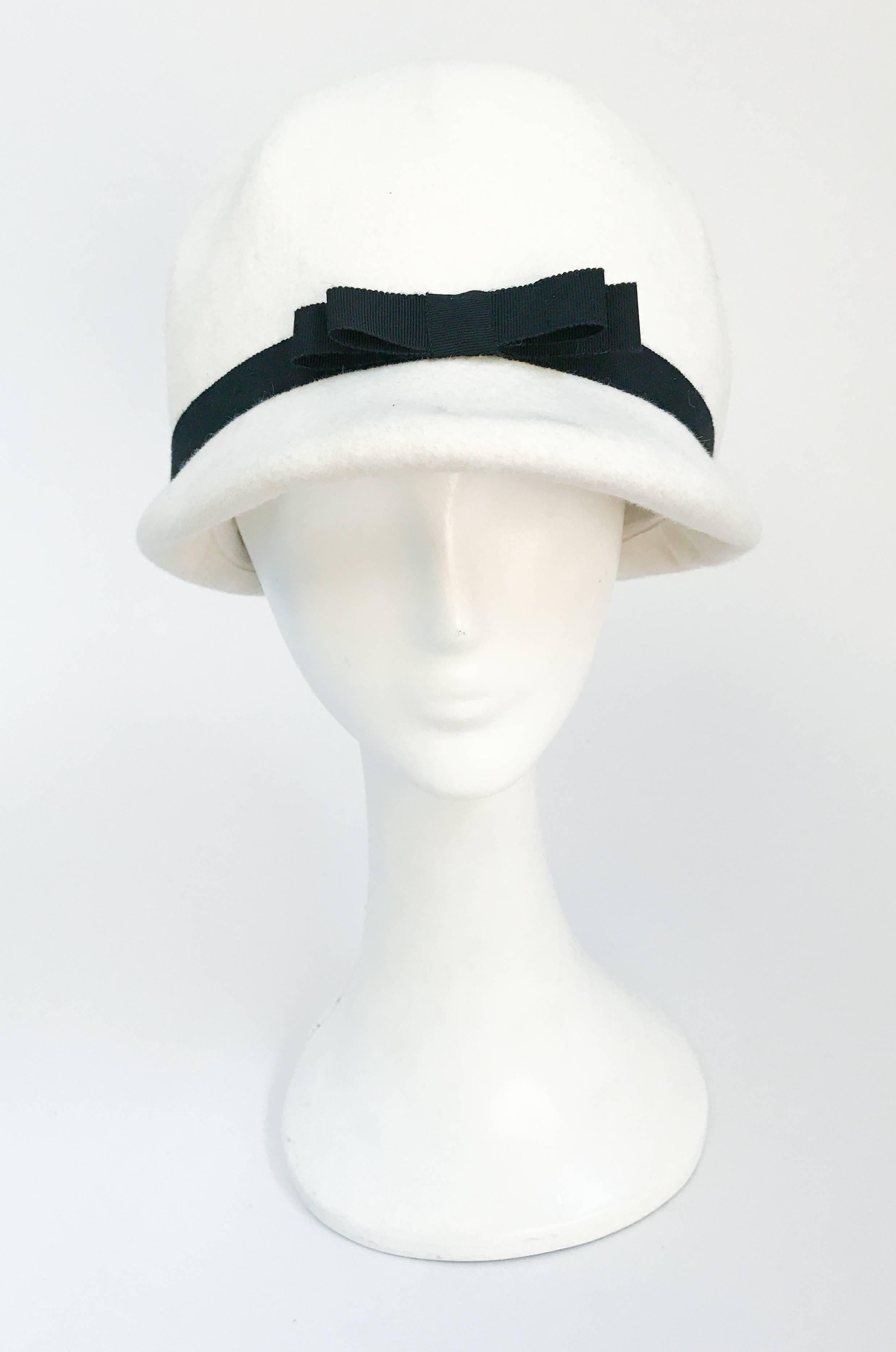 1960's White Mod Wool Helmet. White mod helmet with black gros-grain trim.