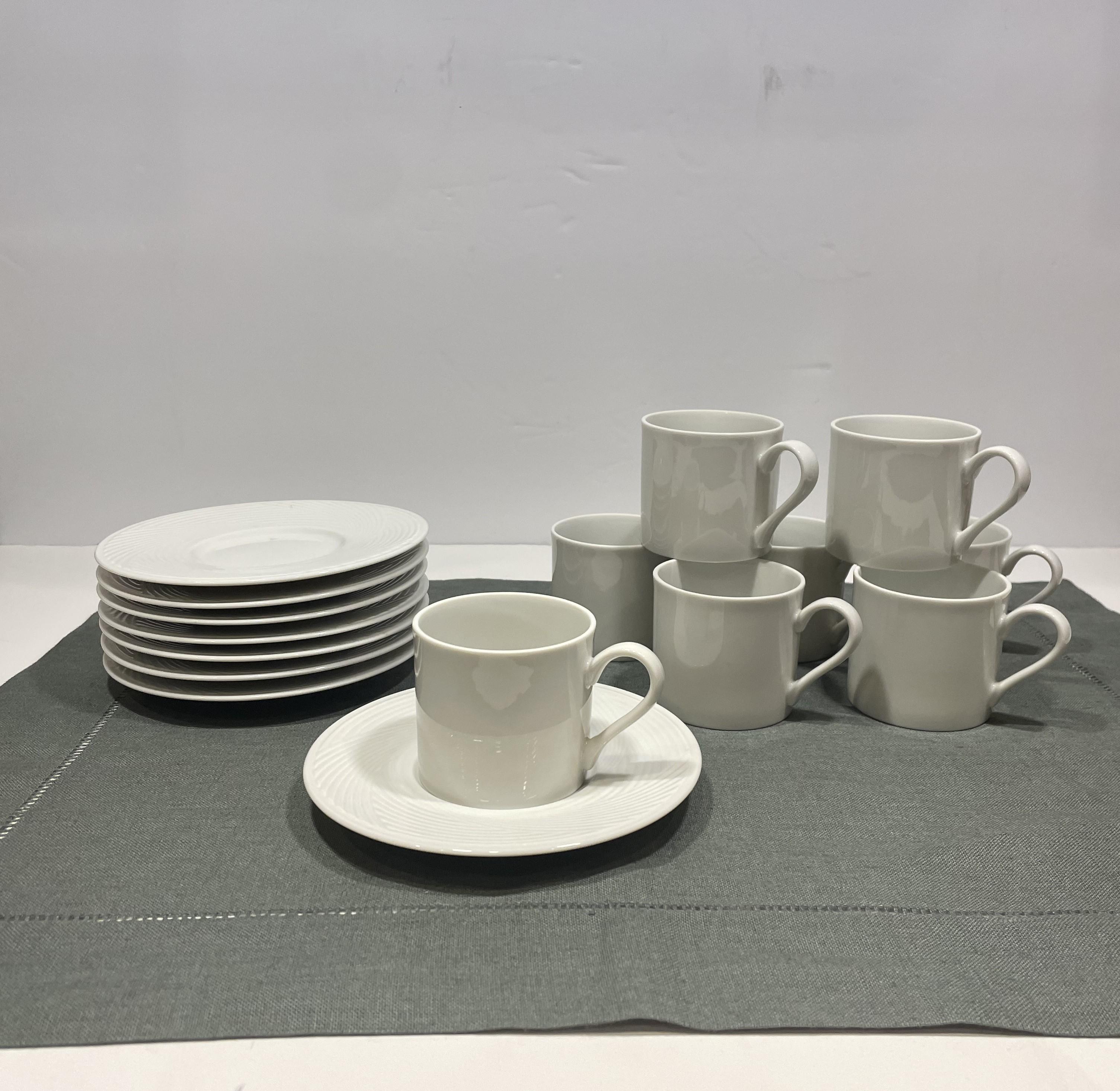 I love this classic set of 8 white porcelain demitasse cups and matching saucers from Dansk, the iconic MCM tableware company. This set was designed for the House of Dansk by Jack Lenor Larsen, the trailblazer in American post-war modernism. They