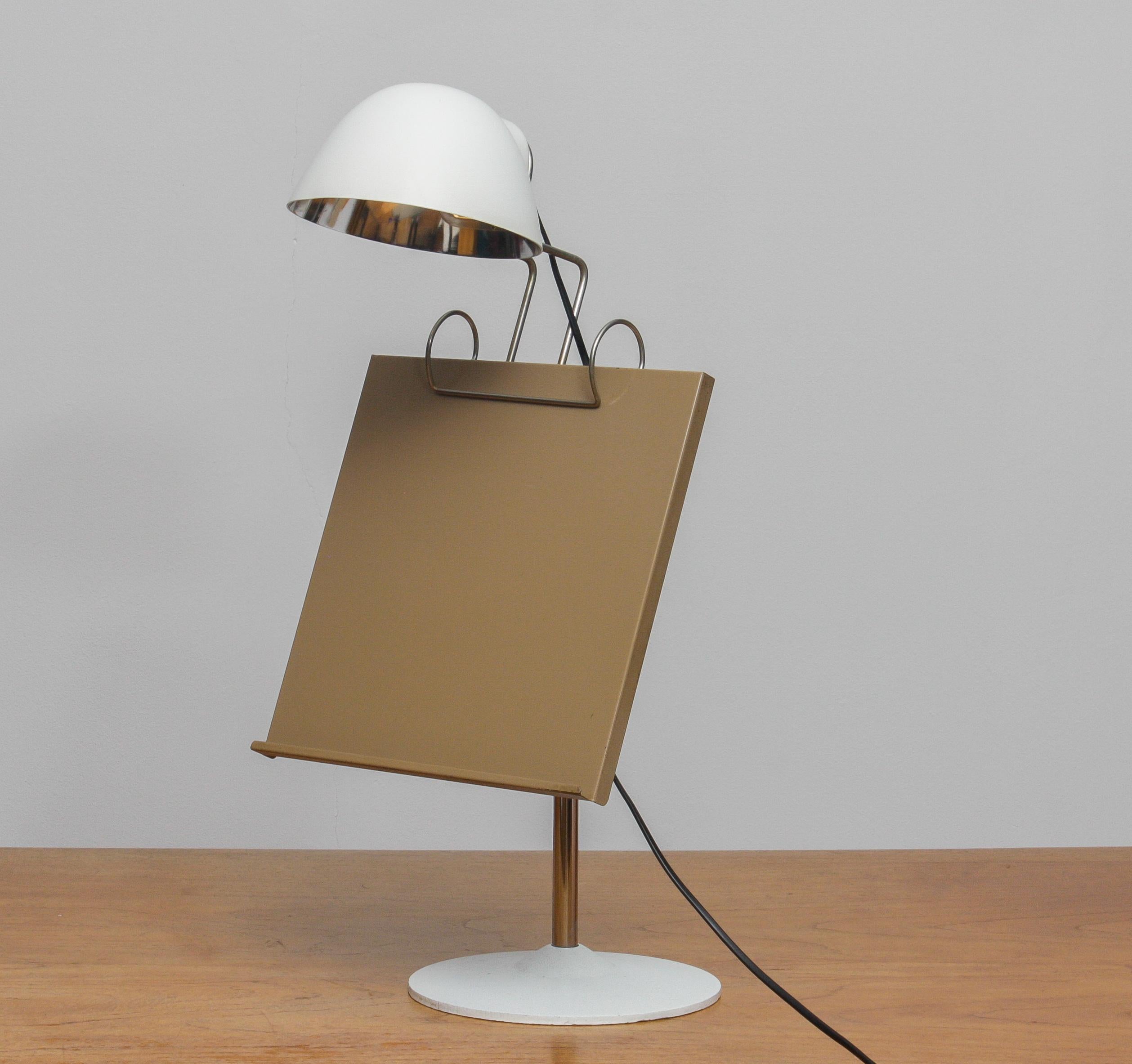 Extremely rare and beautiful table lamp with book stand made by Falkenberg Belysning in Sweden.
The table lamp is perfect condition and uses one E14 / E17 bulb and suits 110 and 230 volts.

Measures: The height is adjustable from 55cm / 21 inch up
