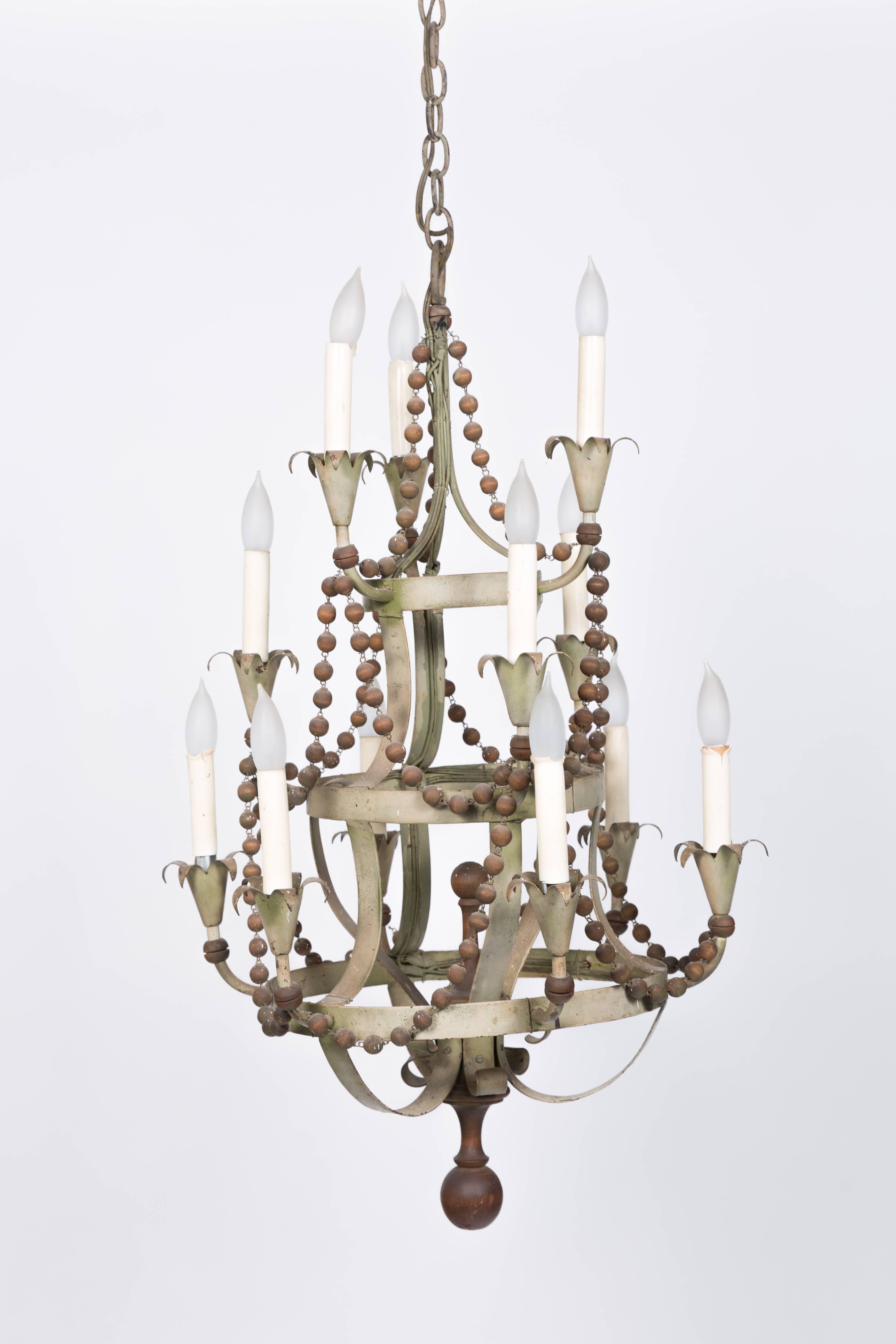 Three-tier 1960s wood beaded and metal chandelier.