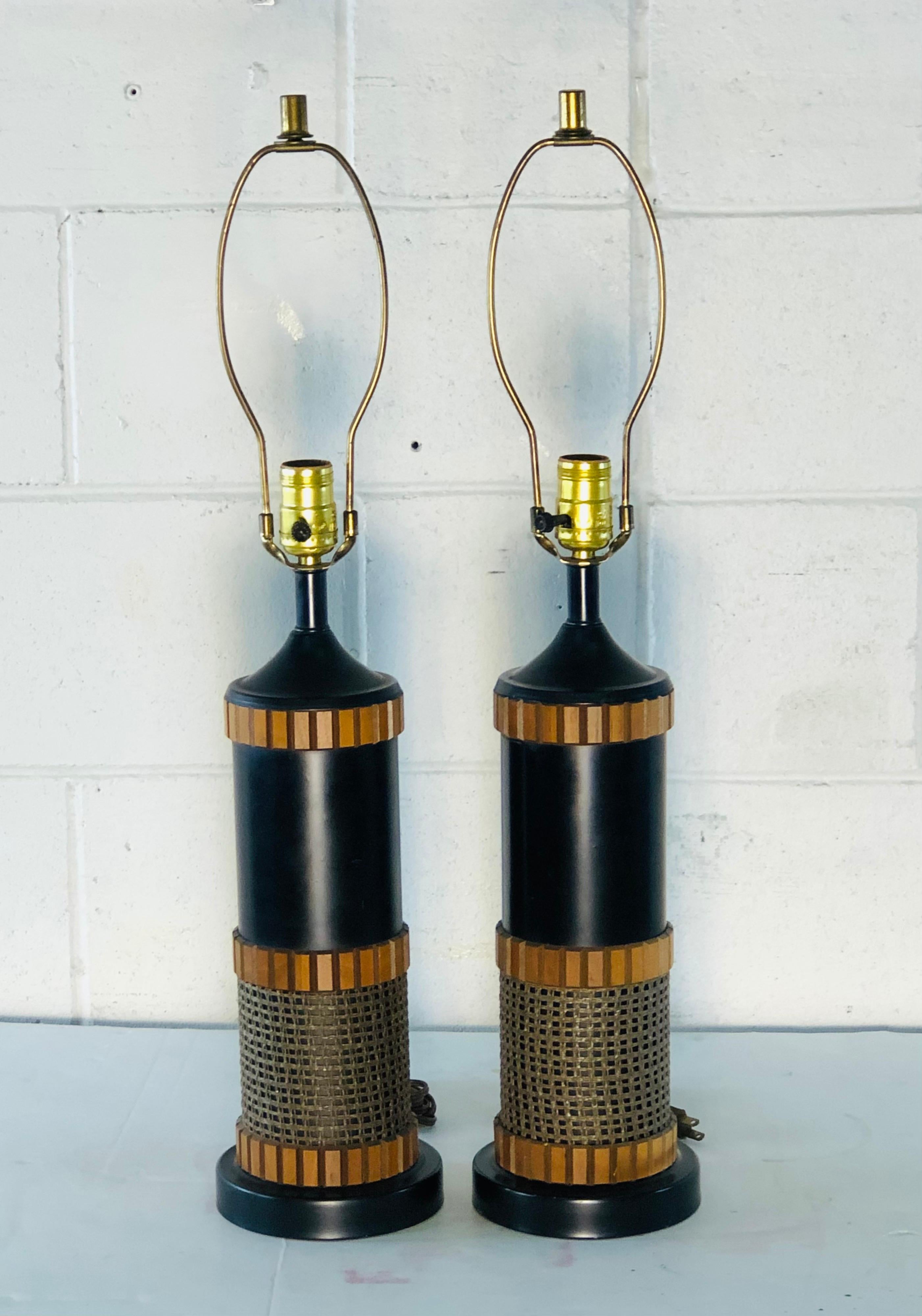 Vintage 1960s pair of wood and burlap style table lamps. The lamps are wired for the US and in working condition. Socket, Measures: 18.5” height harp, 4” diameter x 9” height. Excellent condition. Shades are not included.