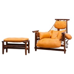 1960s Wood, Leather Cushion Lounge Chair and Ottoman by Jean Gillon