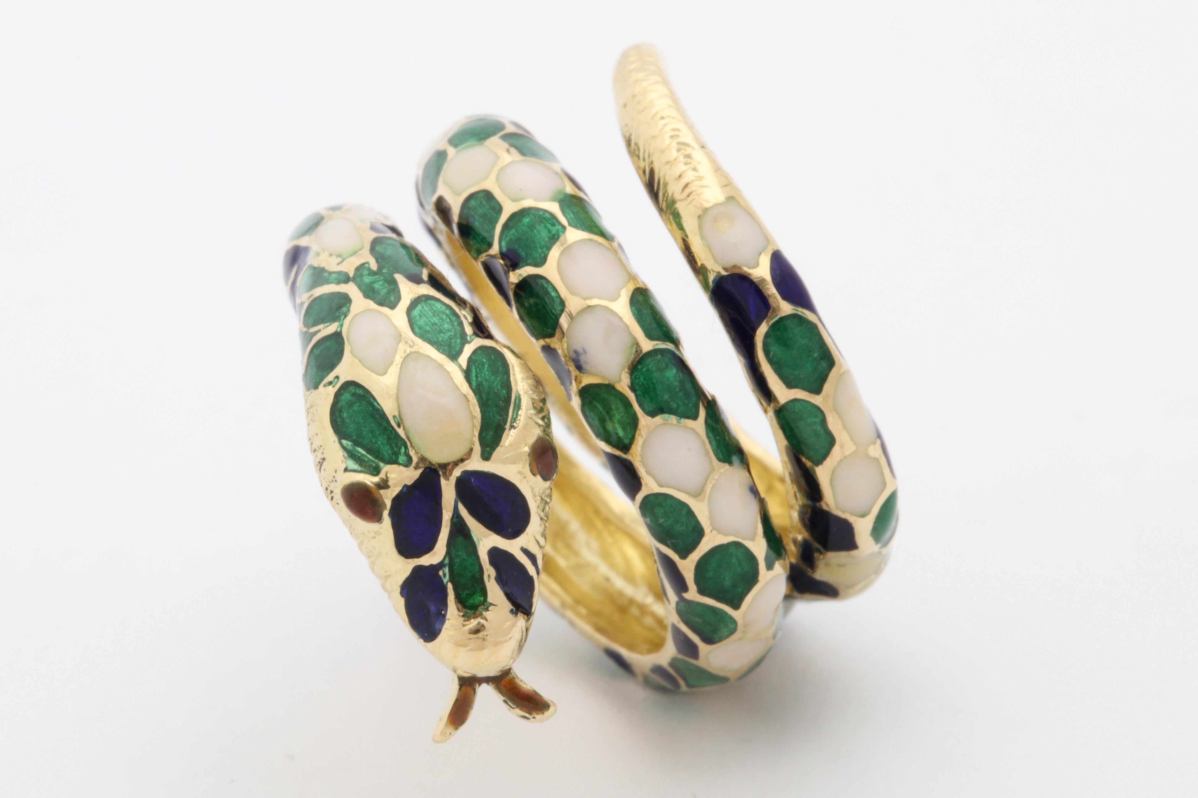 One Ladies Cocktail Ring Designed With Blue,Green And White Hard Enamel Pattern In A Shape Of A Snake. Beautiful Wrap Around Coil Effect To Emulate A Snakes Full Body. Created In 18kt Yellow Gold Ring Fits Size 7 - 7.5 Ring Size.Made In The 1960's