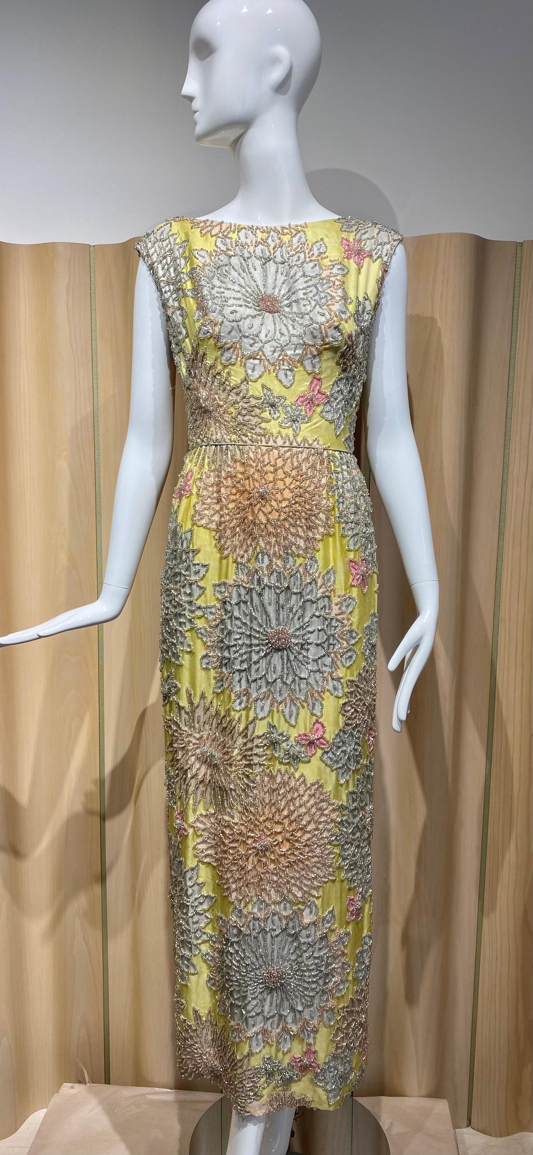 Elegant 1960s Yellow, Grey and Blue Floral Print beaded Sheath sleeveless cocktail dress. 
Fitted waist. 
Size 4
measurement:
B: 34/ Waist 26” / Hip 38”/ Length 52”
*** dress has some issues with loose threads. 
see image attached.