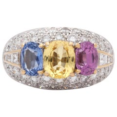 1960s Yellow, Blue, Pink Sapphires with Diamonds Platinum Dome Three-Stone Ring