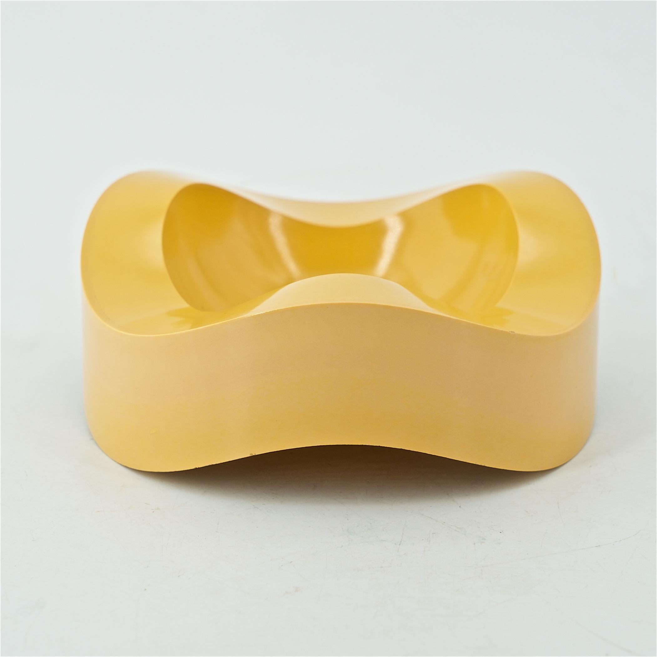 Germany, 1967. A yellow rotomolded abs plastic three wave ashtray, but never used as an ashtray.