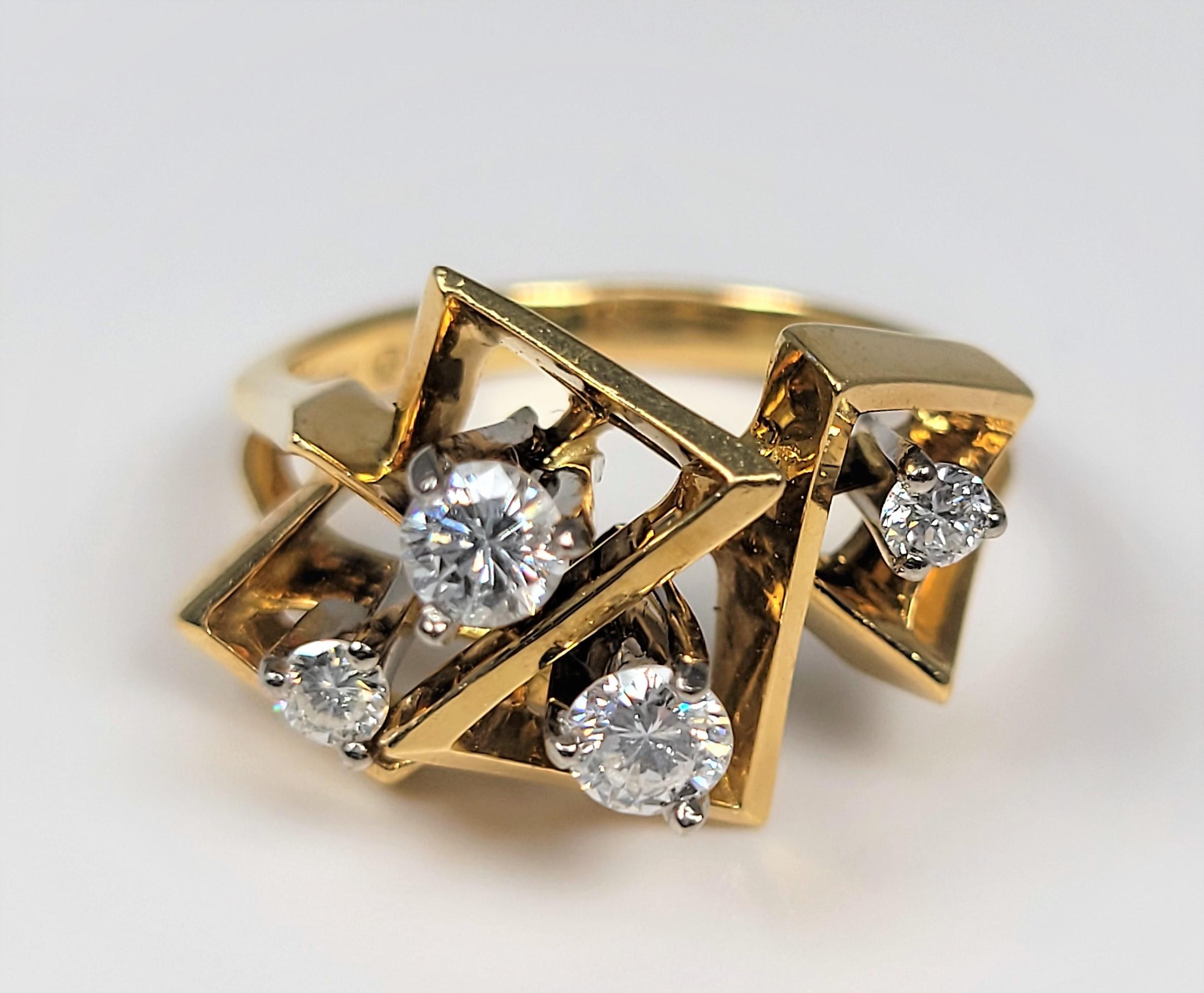 A treasure from the bygone days!  This ring is in 18 karat yellow gold and supports 0.40 carats of diamonds.

