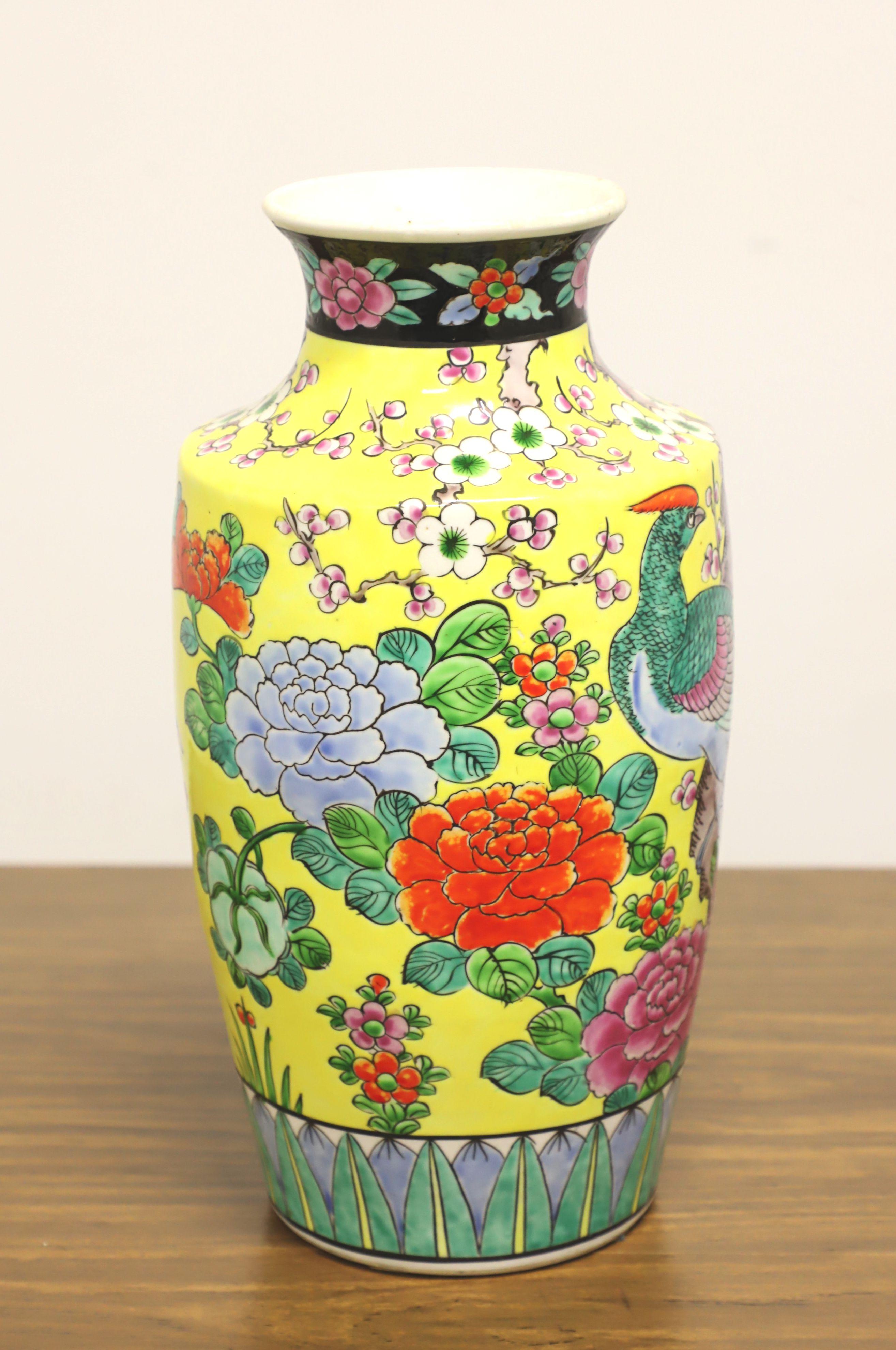 A Japanese chinoiserie style table vase, unbranded. Hand painted ceramic with a Japanese chinoiserie design of foliate, floral & birds in colorful shades of yellow, green, blue, pink, purple, white & black colors, and a tapered urn shape with short