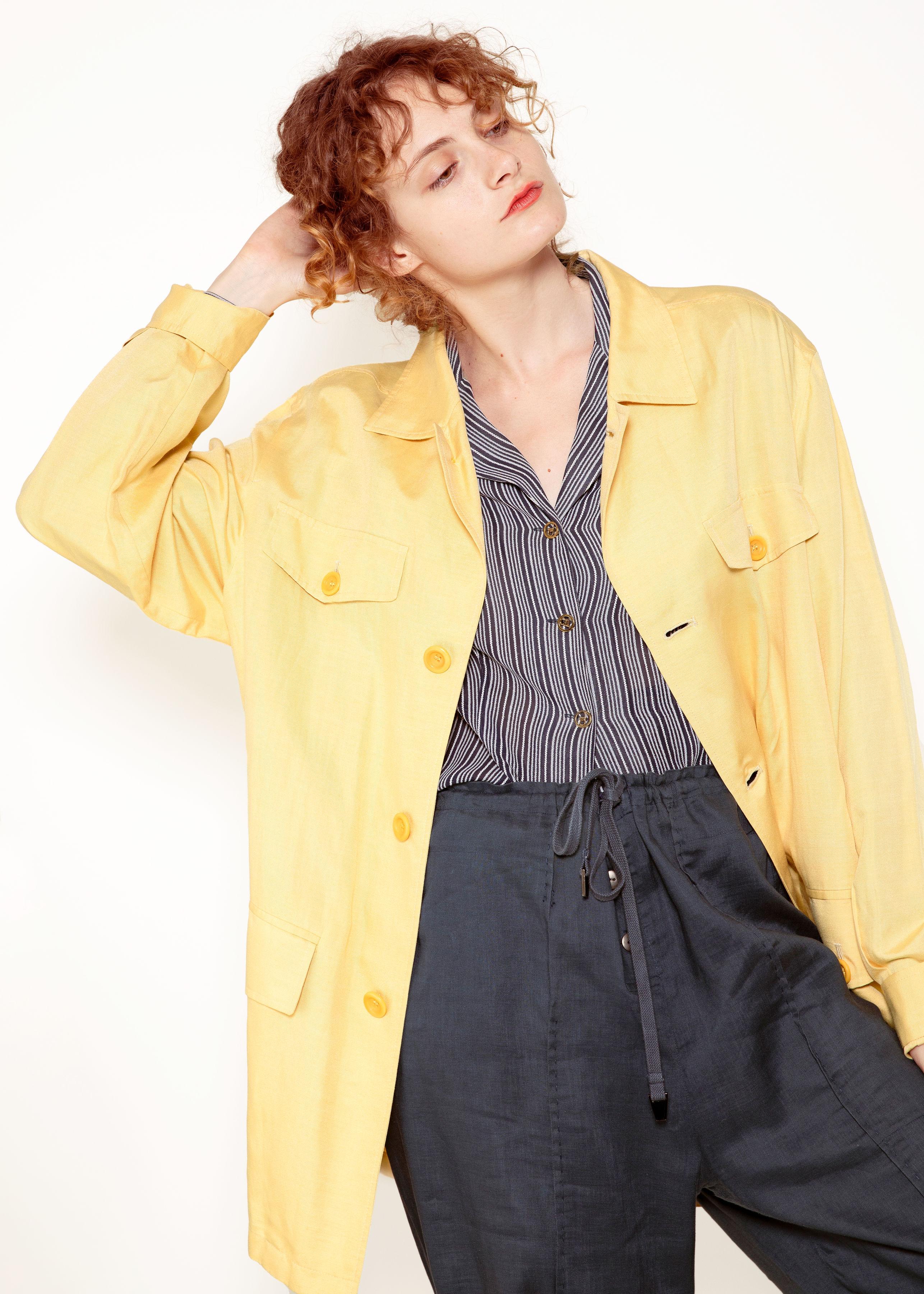 Our 1960's Leisure Yellow Jacket is crafted from a lightweight combination of silk and flax, providing a luxurious and breathable material.

Offering a relaxed fit and two front pockets, this jacket is perfect for a stylish and comfortable look.