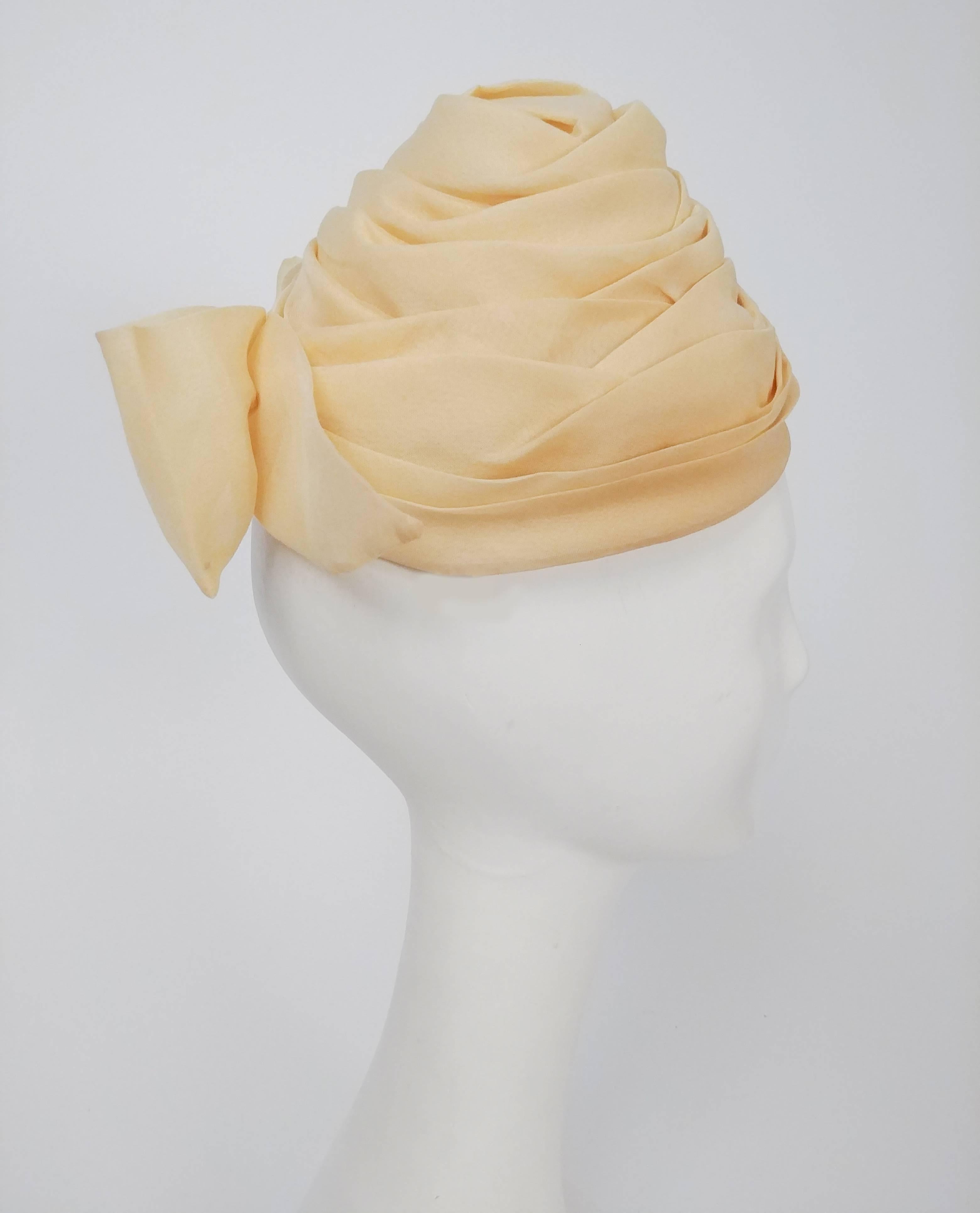 1960s Yellow Organza Turban Hat. Combs hold hat to head at side, finished with decorative bow at back. 